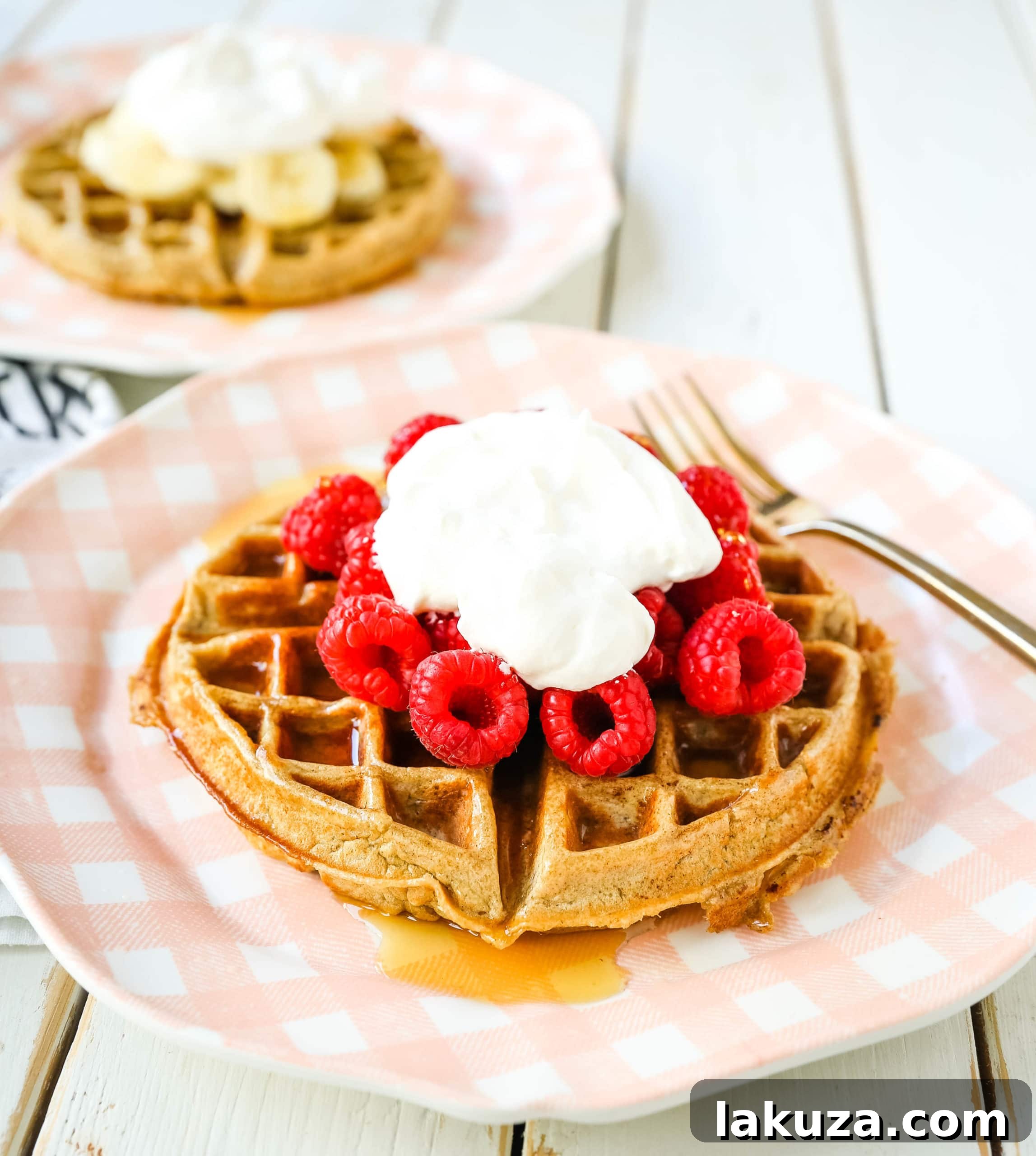 A stack of healthy gluten-free banana oat waffles ready to be served, alongside a waffle maker