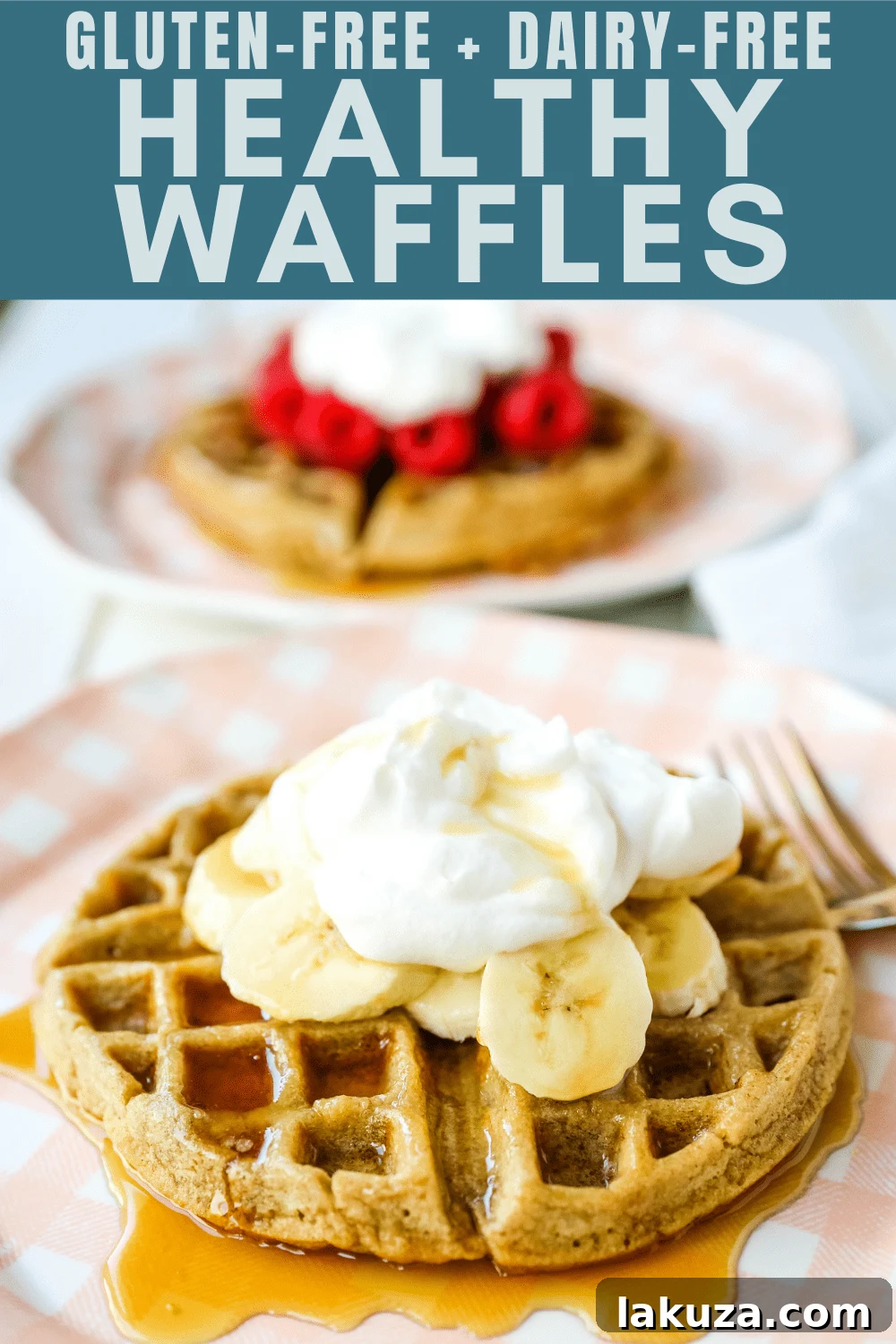 Finished healthy banana oat waffle garnished with blueberries, raspberries, and a dusting of powdered sugar