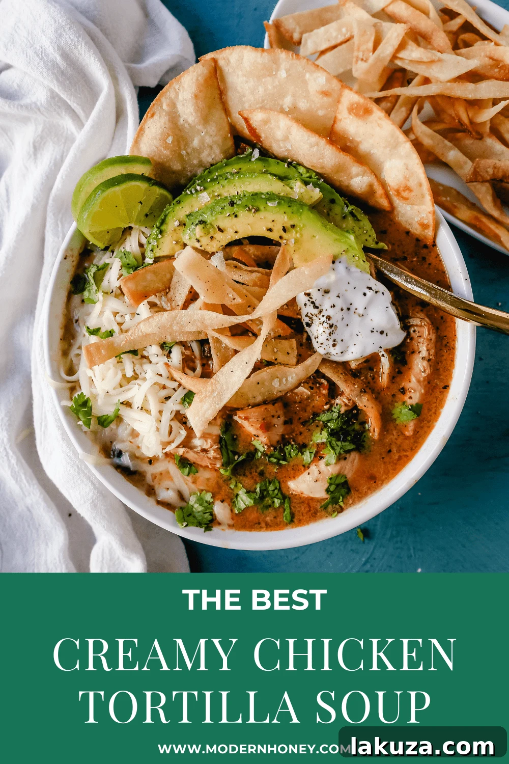 Creamy Slow Cooker Chicken Tortilla Soup 6 Overhead shot of a bowl of creamy chicken tortilla soup with a spoon, ready to be enjoyed.