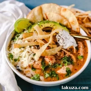 Slow Cooker Creamy Chicken Tortilla Soup, a flavorful and easy crockpot recipe.