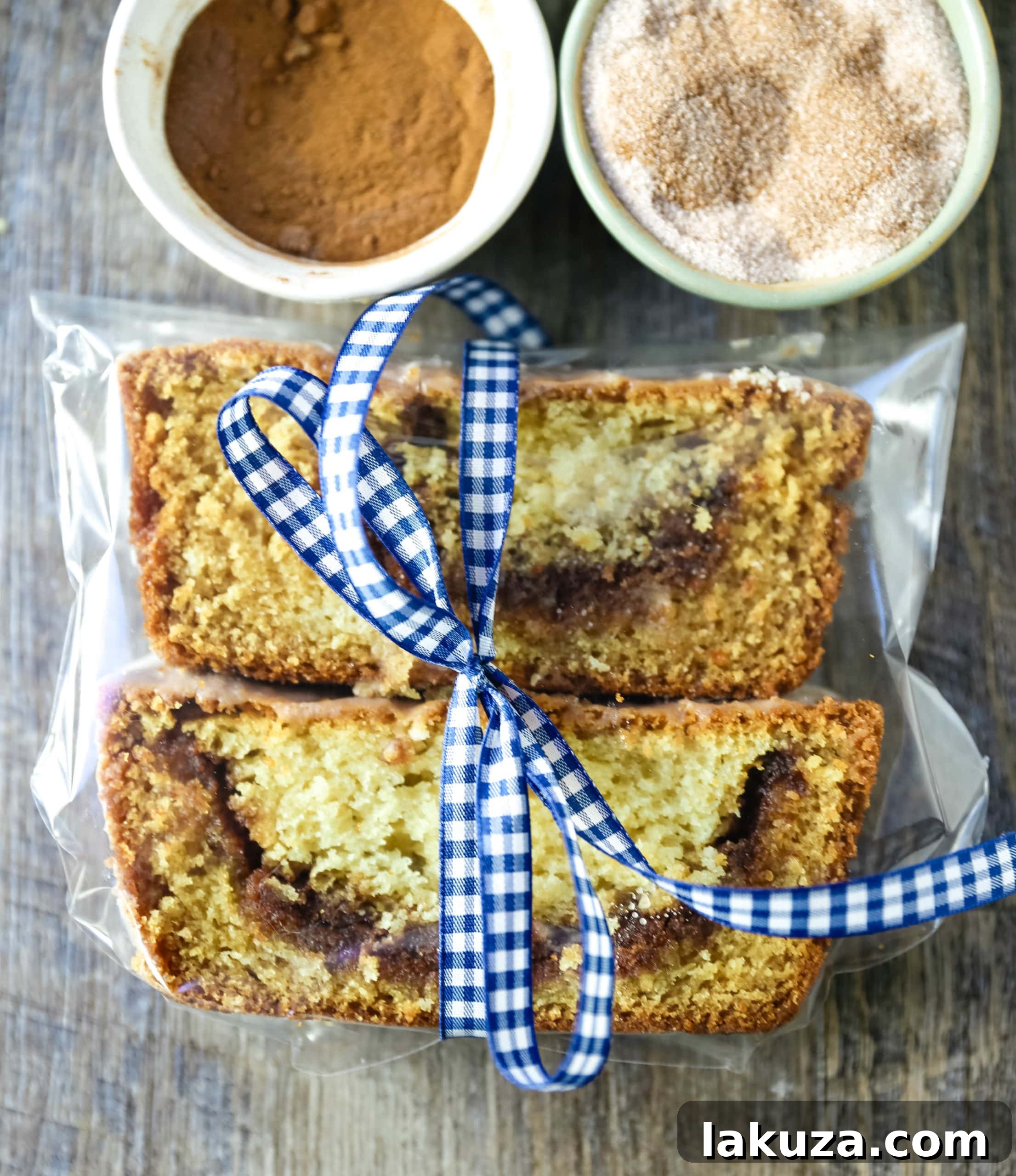 Cinnamon Swirl Quick Bread on a cooling rack, drizzled with vanilla icing