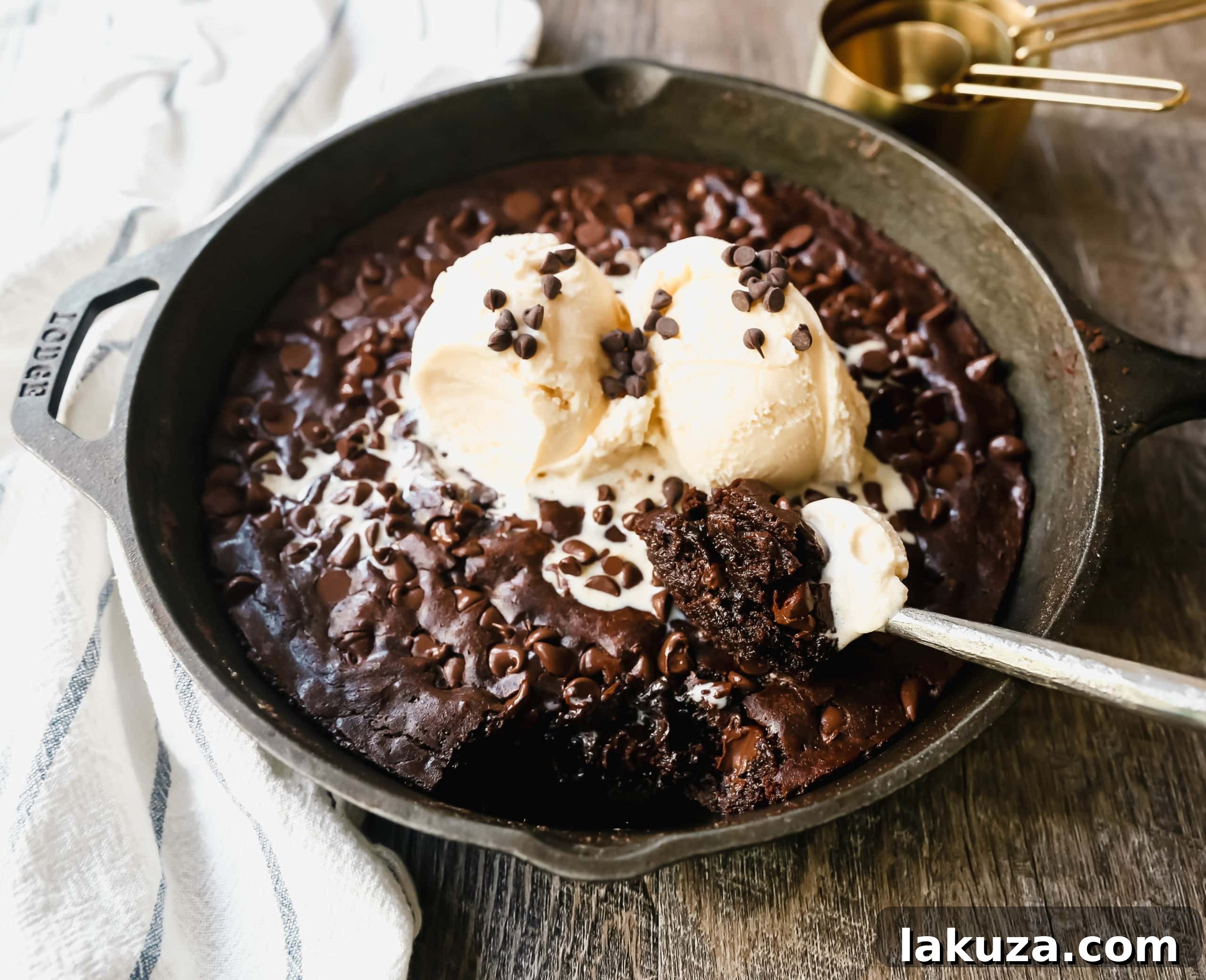 Close-up of a Double Chocolate Chip Skillet Cookie, showcasing its rich texture, studded with chocolate chips, ready to be served.