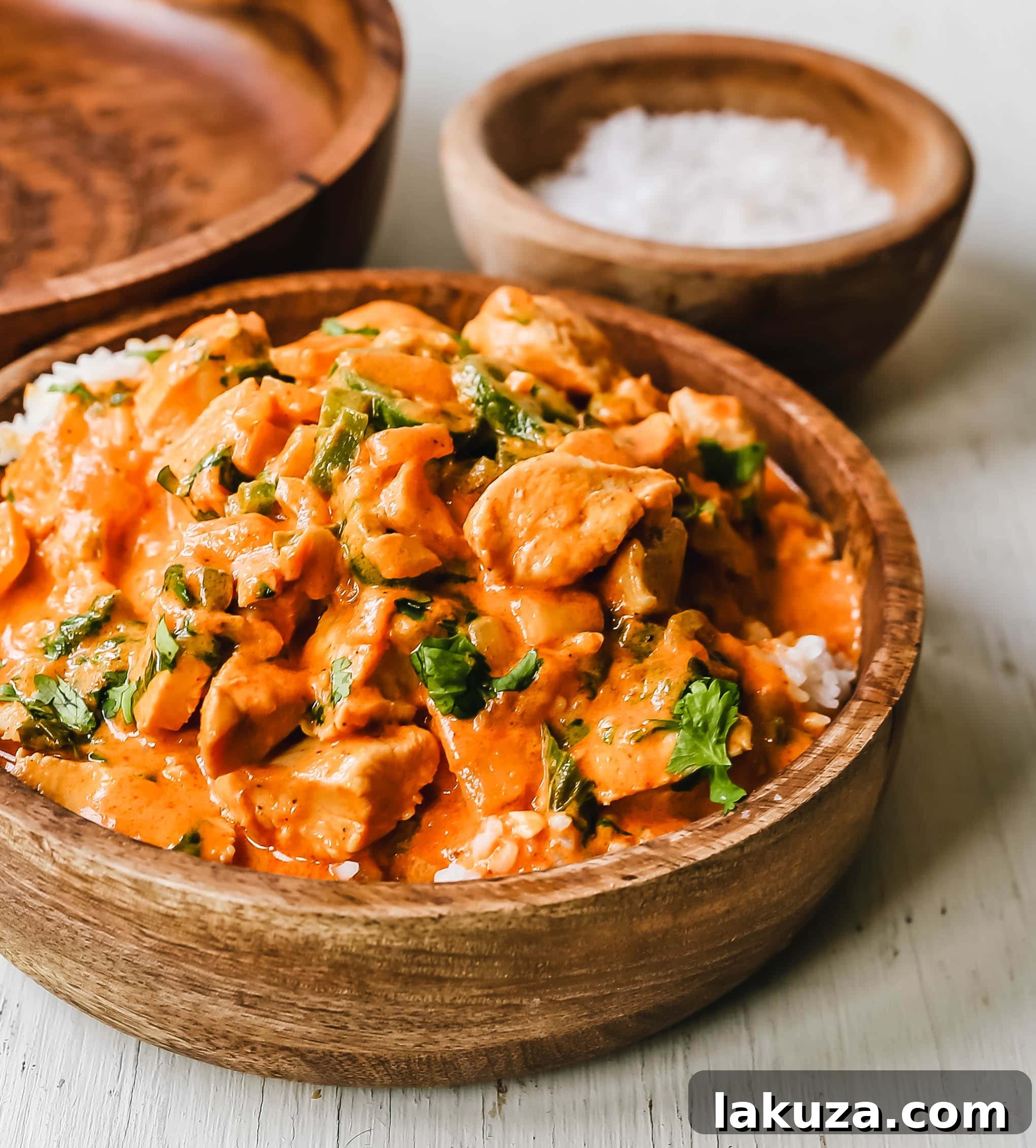 Authentic Thai Red Chicken Curry 4 A rustic bowl filled with aromatic Thai Red Chicken Curry, garnished with fresh herbs, ready for a cozy meal.