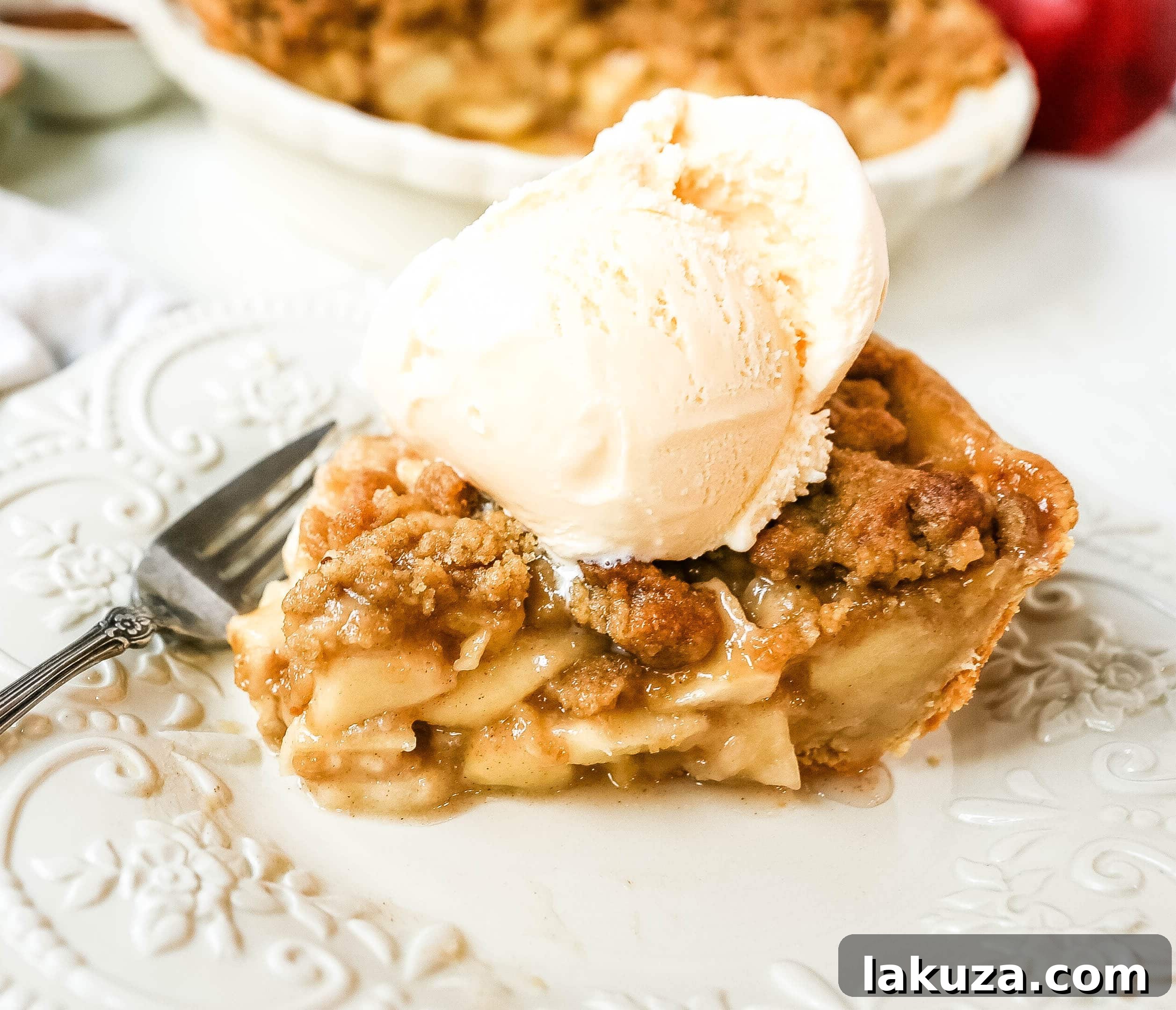 Authentic Dutch Apple Crumble 5 Top-down view of a complete Dutch apple pie, showcasing the texture of the streusel and the perfectly baked crust.