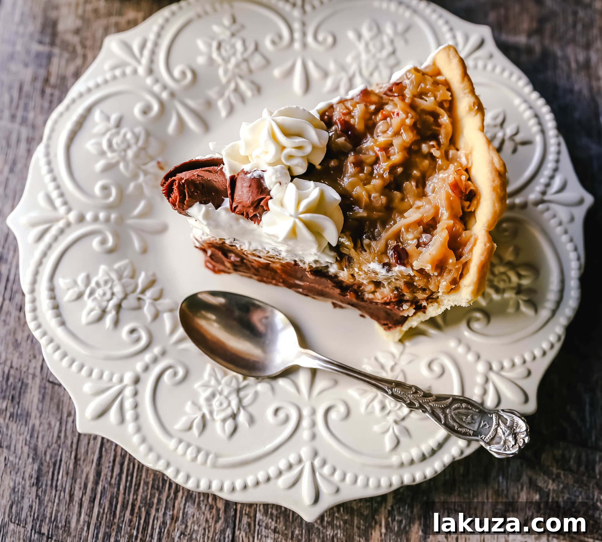 Decadent German Chocolate Pie 6 Assembled German Chocolate Pie, topped with whipped cream and chocolate shavings, ready to serve.