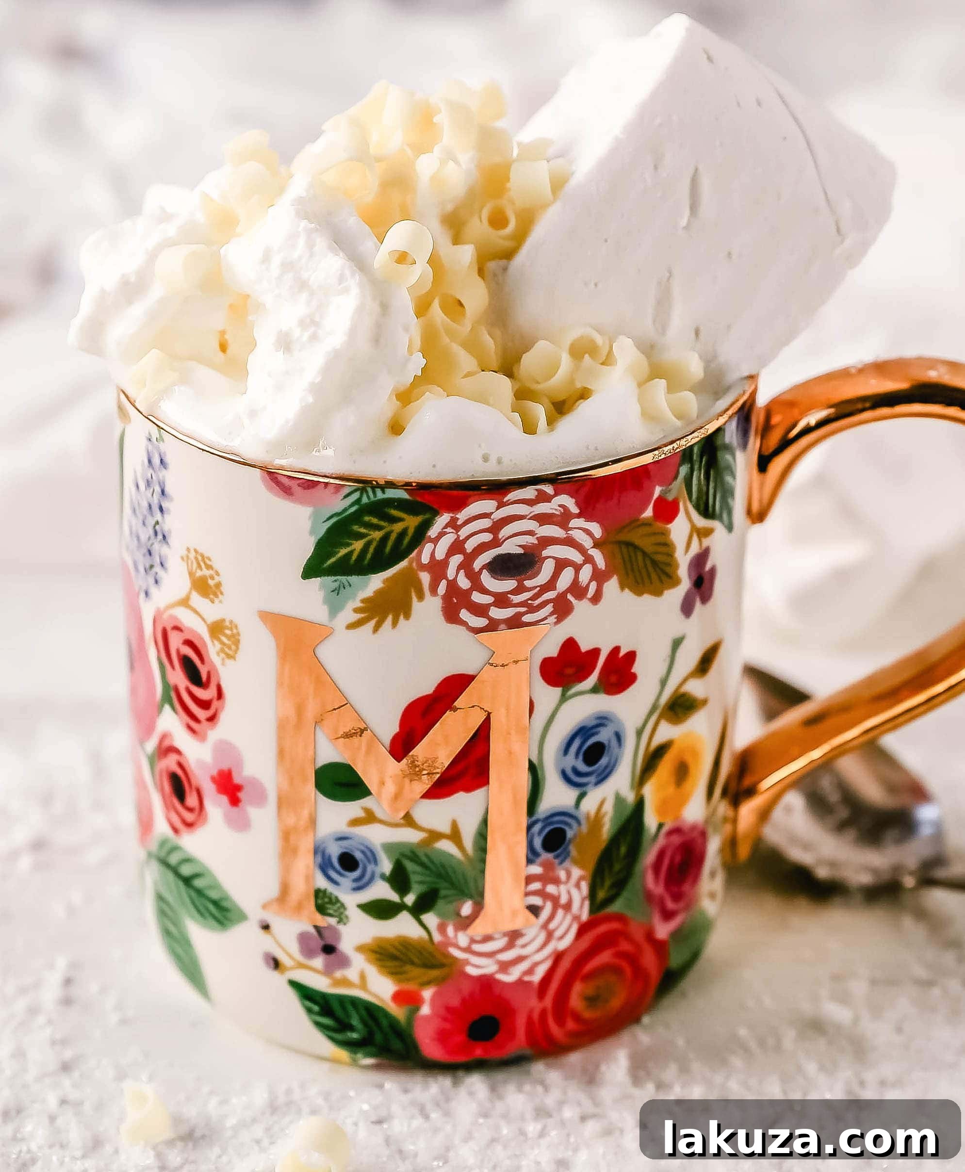 A cozy scene: a mug of homemade white hot chocolate resting on a rustic wooden surface, inviting warmth and comfort.