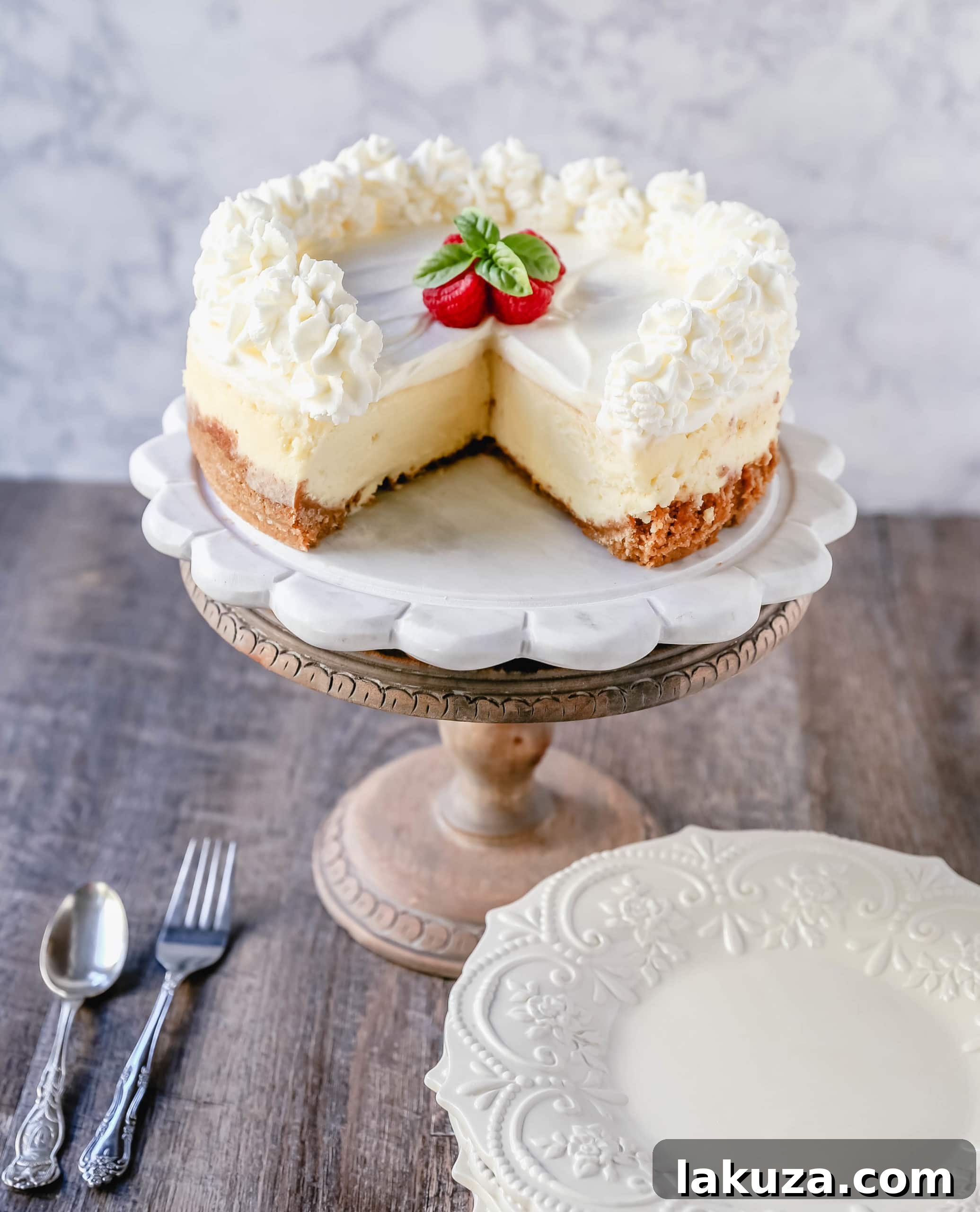 Vanilla Bean Cheesecake 2 The Best Cheesecake Recipe: How to make the creamiest, dreamiest, richest vanilla cheesecake with a buttery graham cracker crust. All of the tips and tricks for making the perfect cheesecake! www.modernhoney.com #cheesecake #vanillacheesecake #cheesecakerecipe #dessert