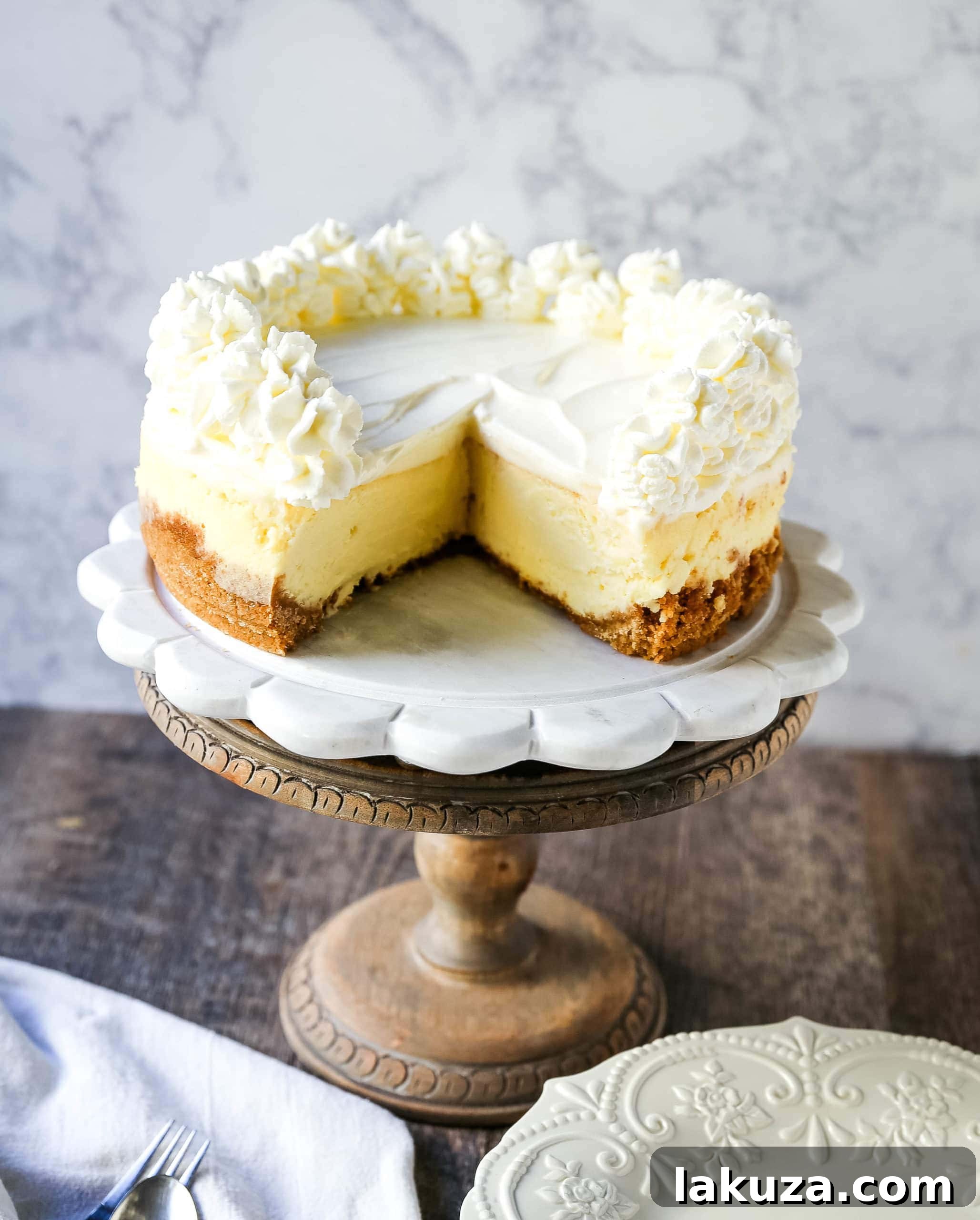 Vanilla Bean Cheesecake 9 The Best Cheesecake Recipe: How to make the creamiest, dreamiest, richest vanilla cheesecake with a buttery graham cracker crust. All of the tips and tricks for making the perfect cheesecake! www.modernhoney.com #cheesecake #vanillacheesecake #cheesecakerecipe #dessert