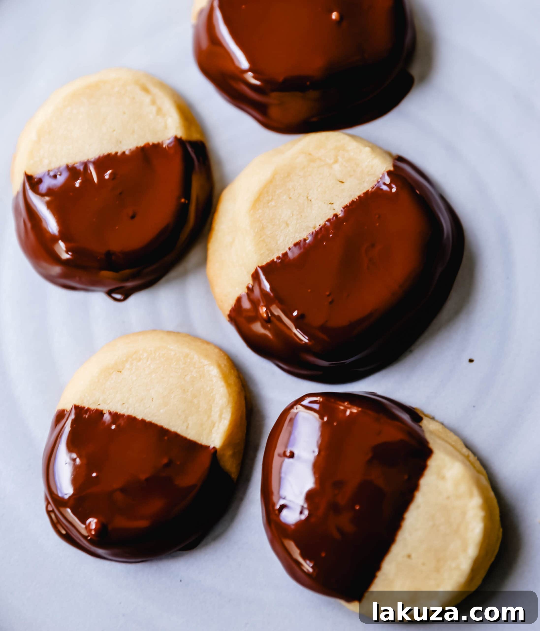 Gourmet Chocolate Dipped Pistachio Shortbread 5 Hands pressing shortbread dough together, showing its crumbly yet cohesive texture before chilling.