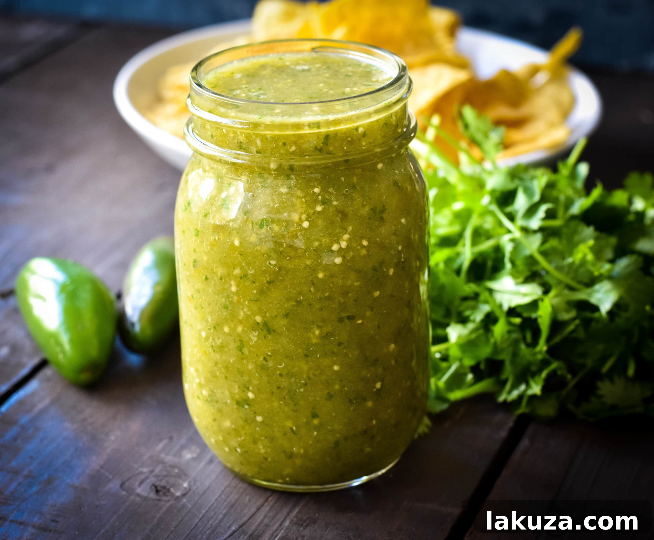 Sweet Emerald Salsa 3 Close-up of fresh Sweet Salsa Verde with bright green tomatillos and cilantro, showcasing its vibrant texture
