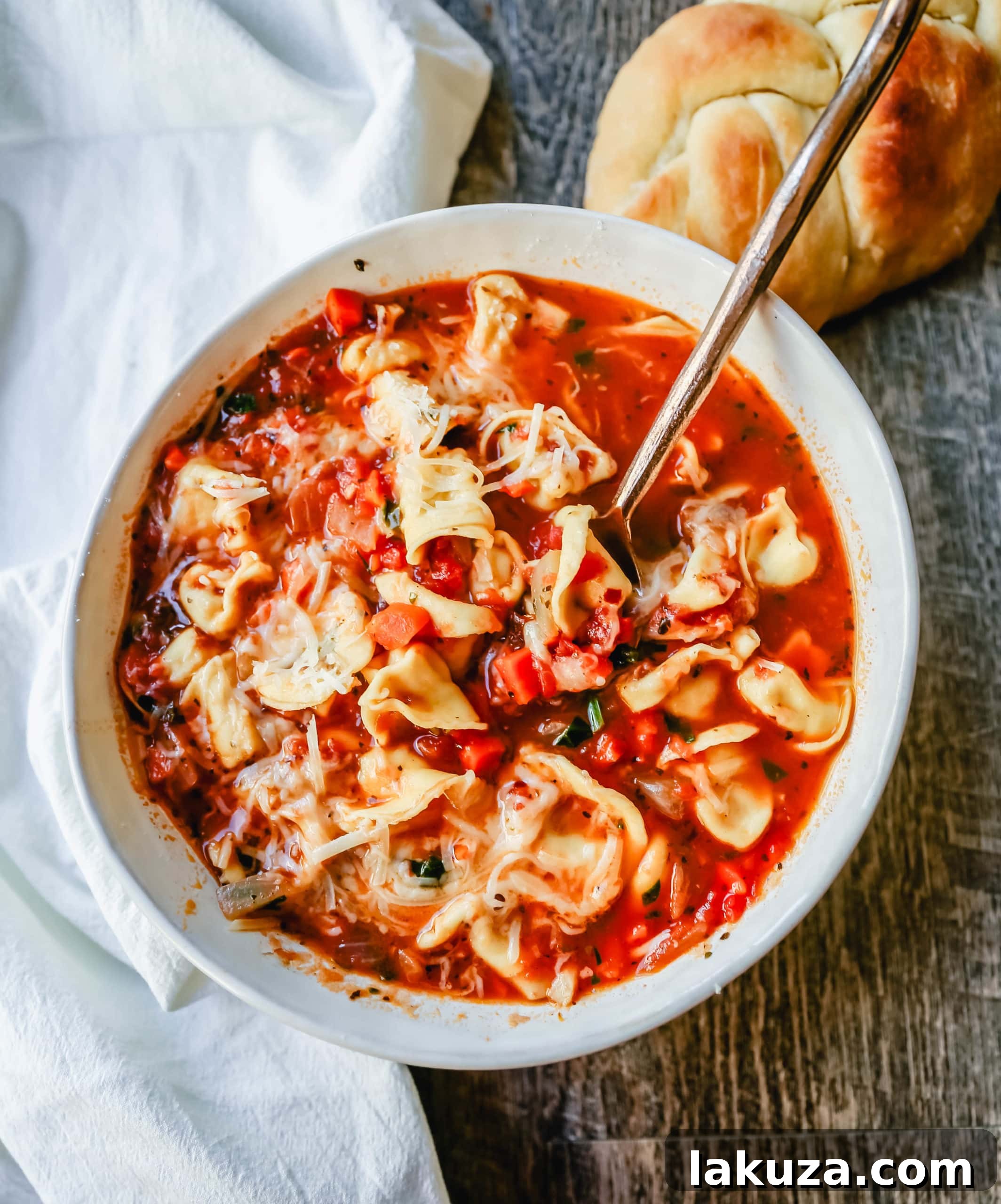 Wholesome Garden Tortellini Soup 5 A serving of Tuscan Tortellini Vegetable Soup ready to be enjoyed with fresh bread