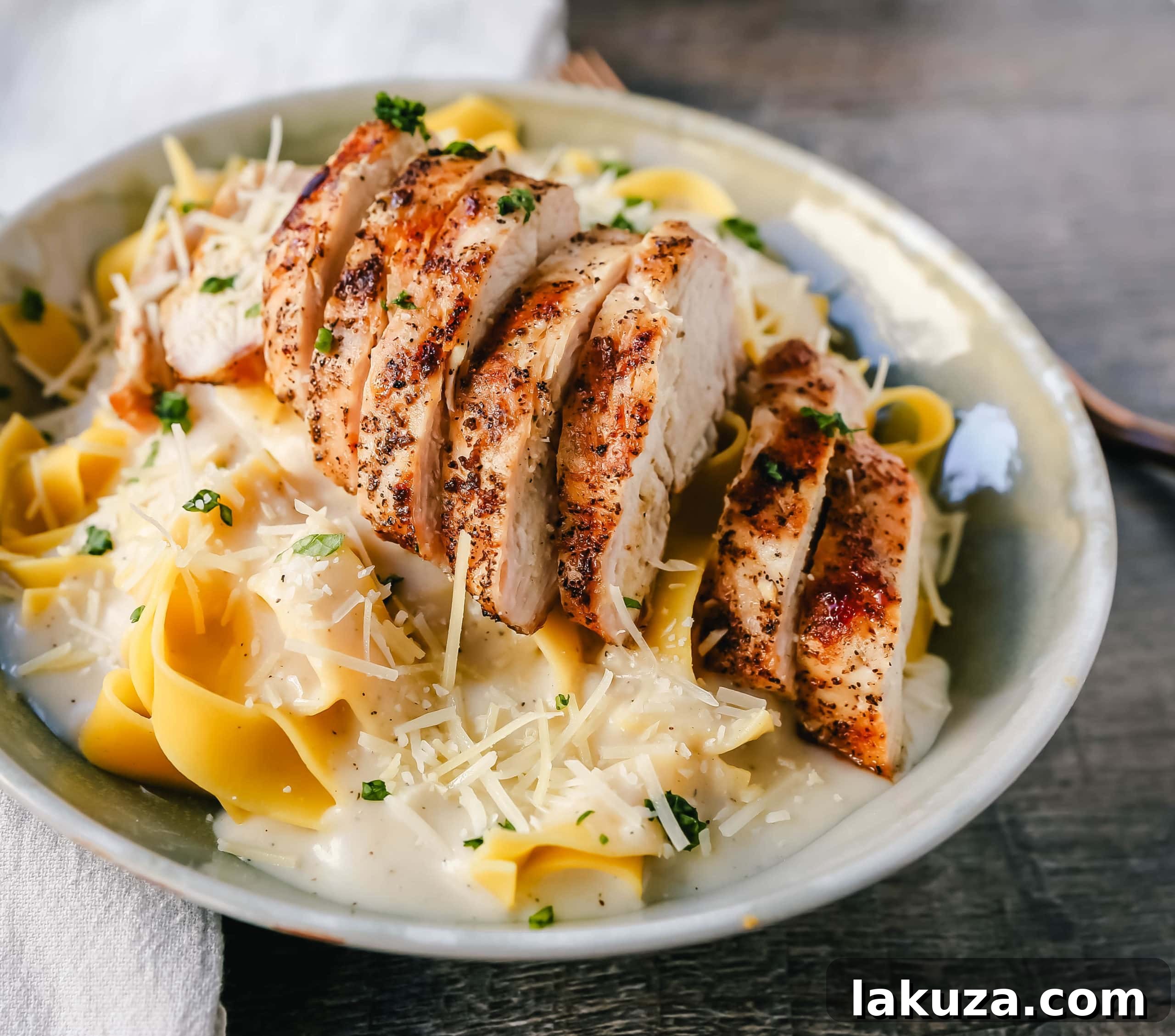 Skinny Low-Fat Chicken Fettuccine Alfredo: Enjoy all the flavor of classic Chicken Fettuccine Alfredo without the excess fat and calories. Featuring lean grilled chicken atop a creamy, low-fat alfredo sauce tossed with perfectly cooked fettuccine noodles.