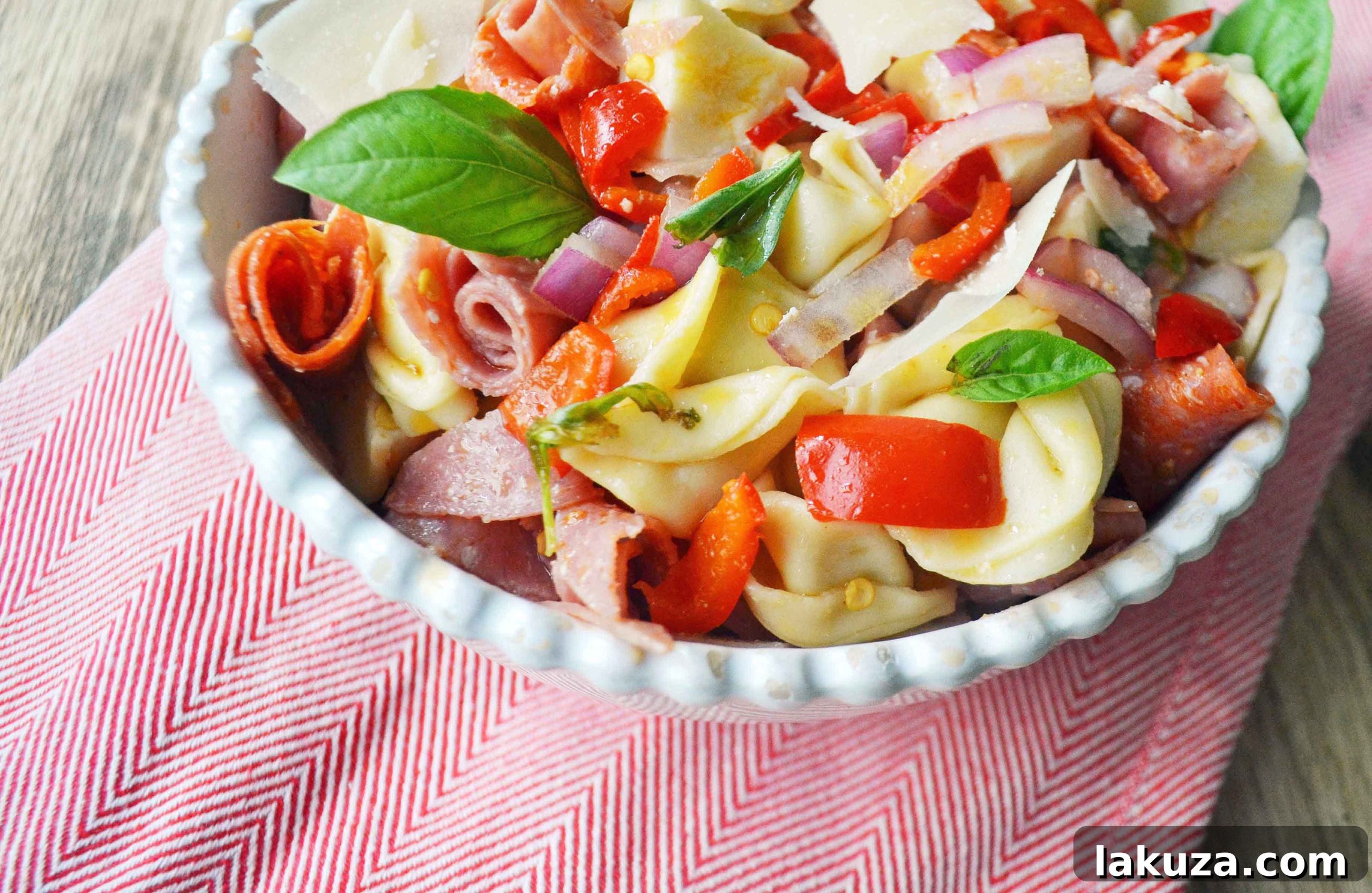 Overhead shot of Antipasto Tortellini Pasta Salad in a large serving bowl