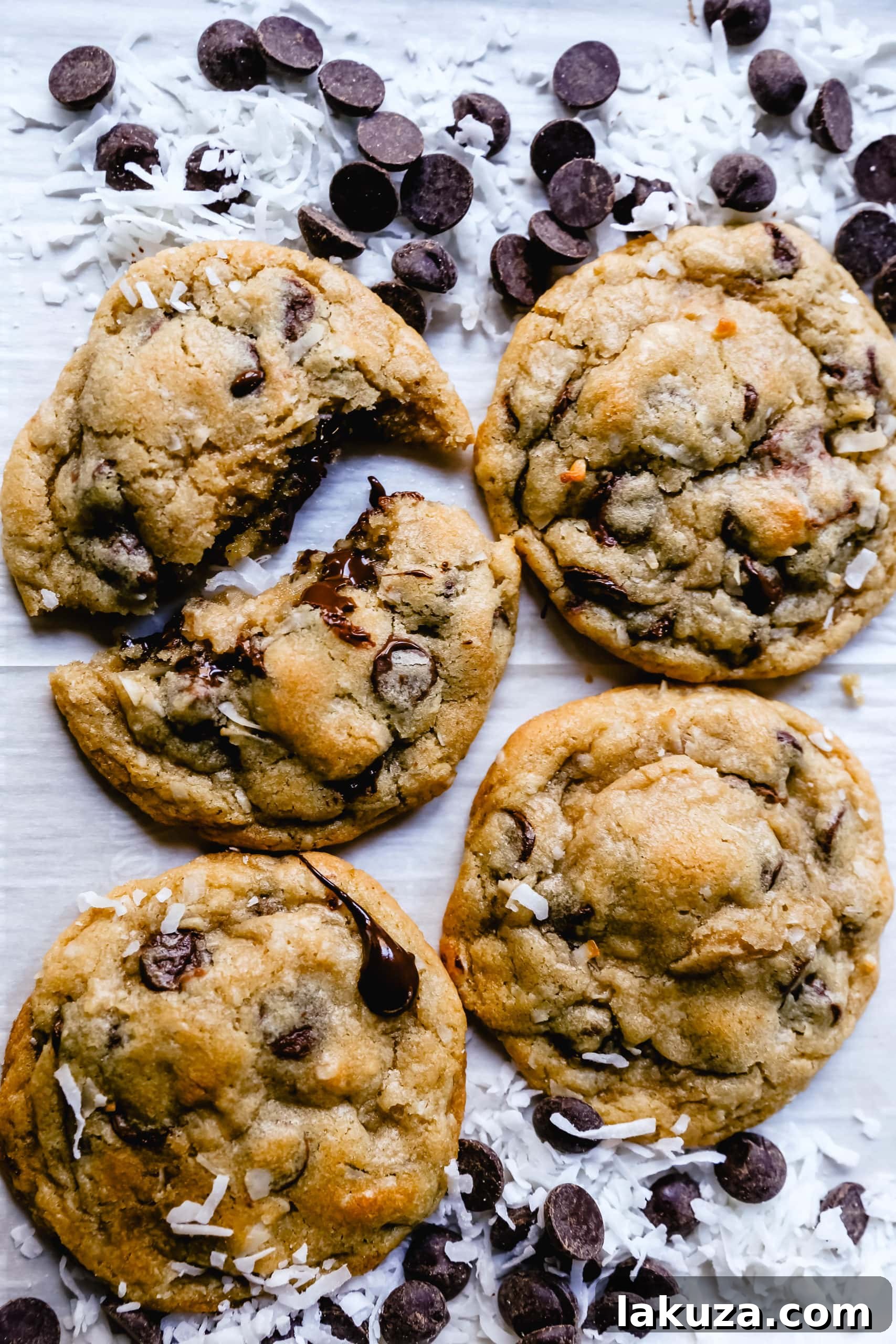 Tropical Chocolate Chip Coconut Cookies 4 A stack of golden-brown chocolate chip coconut cookies, showcasing their inviting texture and generous chocolate and coconut content, ready to be enjoyed.