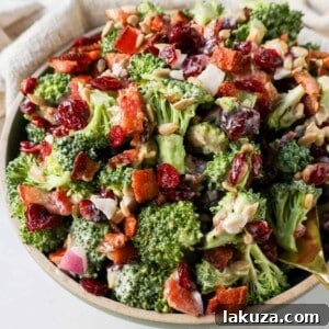 Crunchy, easy broccoli salad with crispy bacon, sweet dried cranberries, onion, and nuts all tossed in a sweet and tangy dressing. Tips for making the best broccoli salad. A classic potluck, BBQ, or summer side dish recipe!