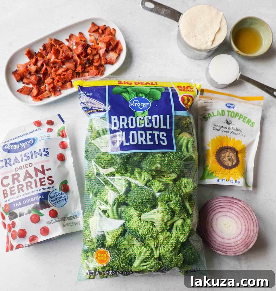 Broccoli Salad Ingredients. What Ingredients go in broccoli salad. Broccoli Salad made with bacon, cranberries, onion, nuts, and sweet and tangy dressing.
