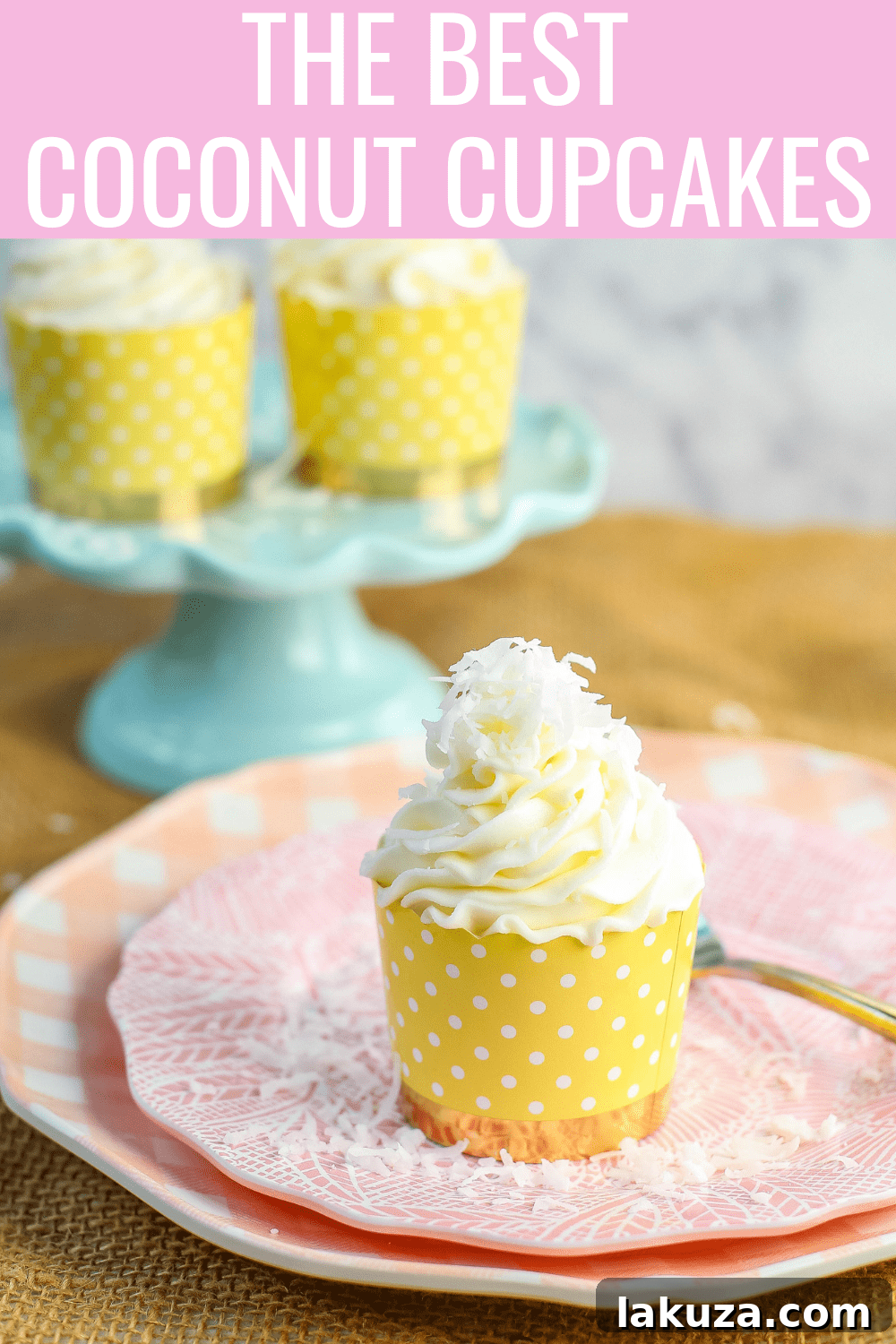 A close-up shot of a single coconut cupcake, beautifully frosted and decorated.