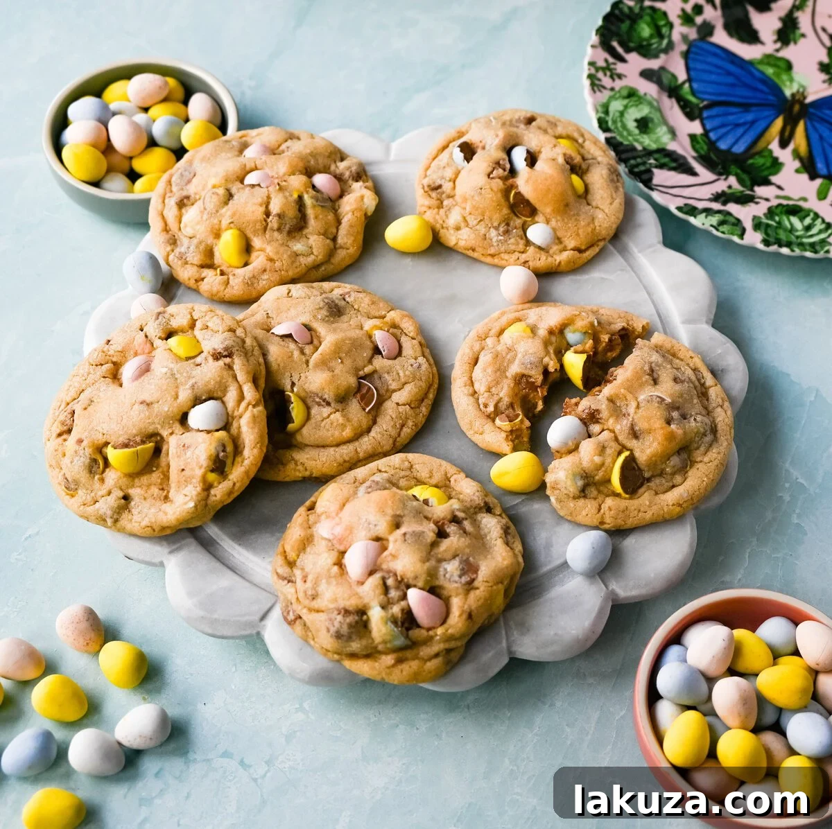 Ingredients for Cadbury Egg Cookies laid out, including butter, sugars, flour, and mini Cadbury eggs.