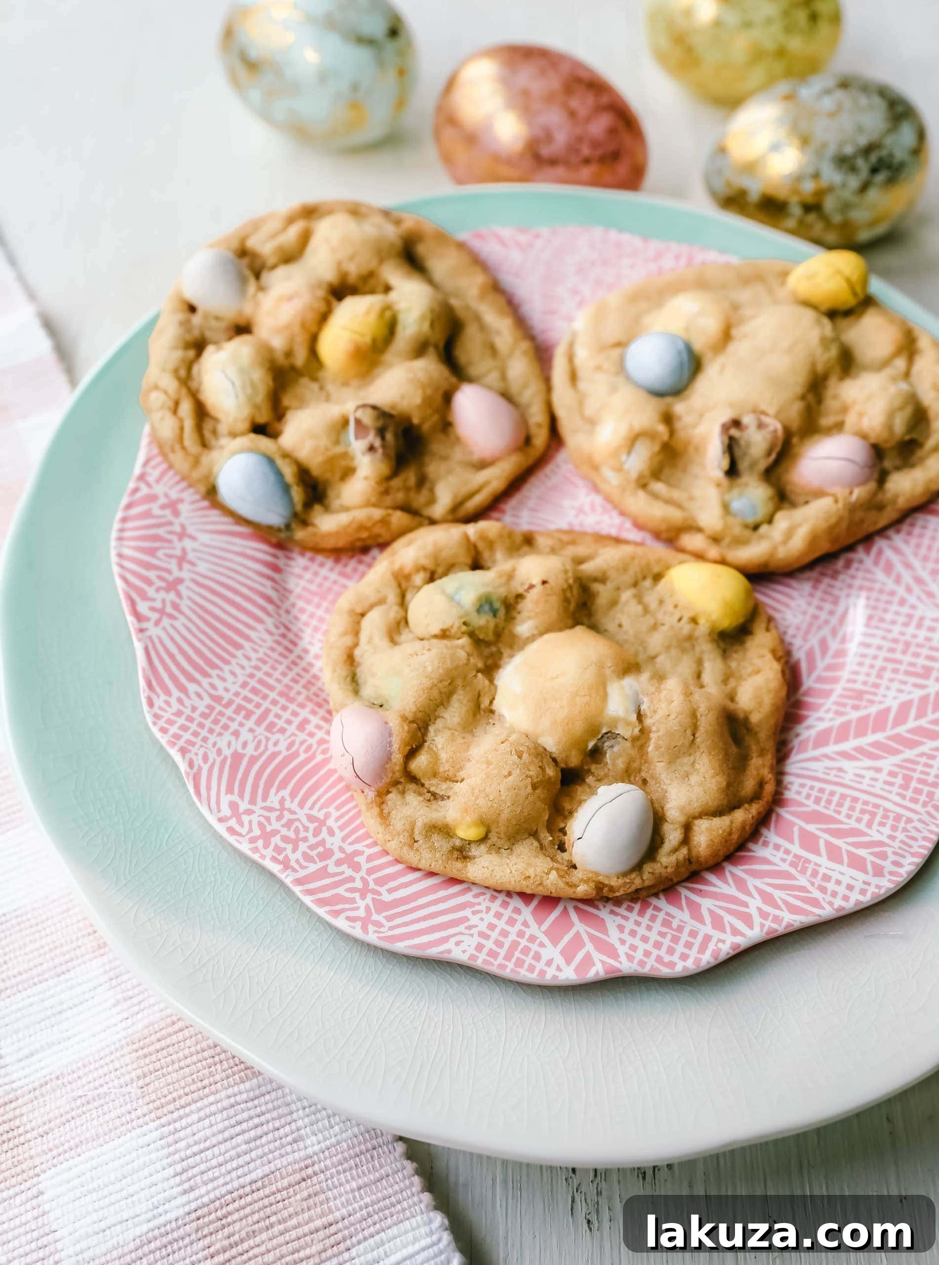 Chocolate Cadbury Egg Cookies - A white chocolate chip and famous chocolate mini Cadbury eggs cookie. Soft and chewy centers with crispy edges and decadent mini Cadbury eggs. A perfect Easter cookie!