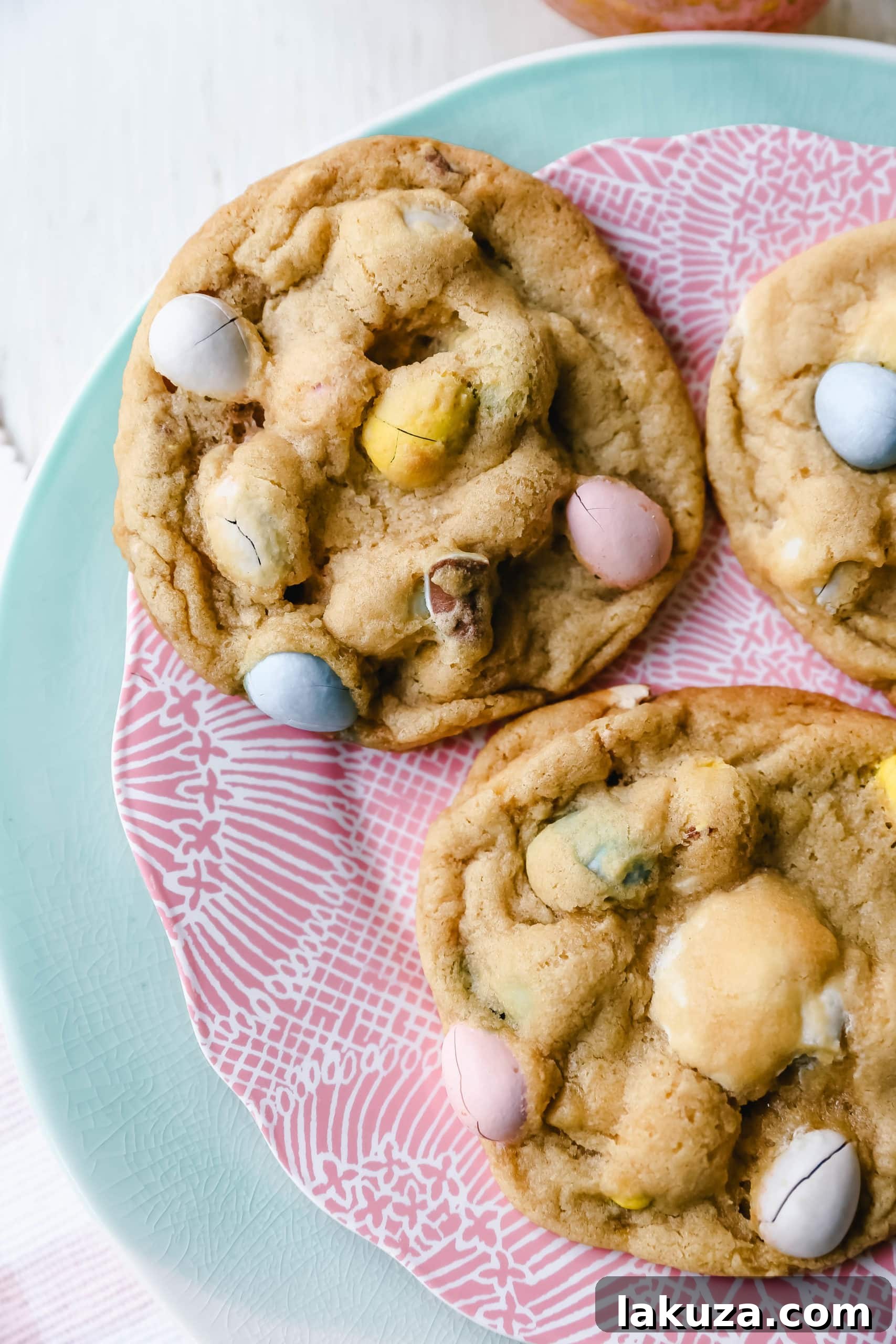 Chocolate Cadbury Egg Cookies - A white chocolate chip and famous chocolate mini Cadbury eggs cookie. Soft and chewy centers with crispy edges and decadent mini Cadbury eggs. A perfect Easter cookie! www.modernhoney.com #cookie #cookies #eastercookie #cadburyeggs