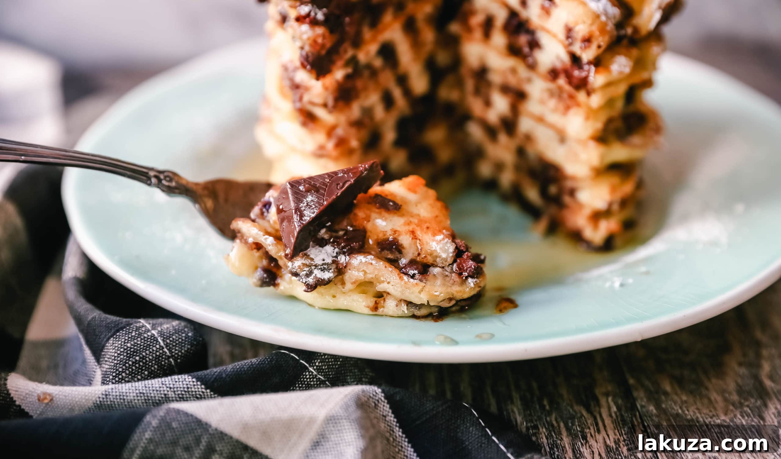 Ricotta Pancake Toppings - Powdered sugar, maple syrup, chocolate chips, and whipped cream for delicious homemade chocolate chip ricotta pancakes.