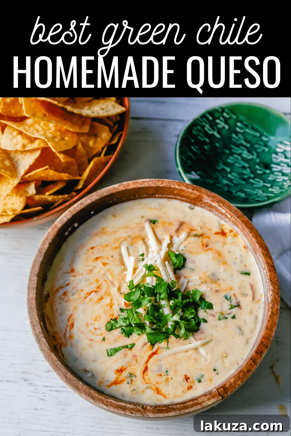 A delicious bowl of homemade green chile queso dip, perfectly creamy and flavorful, ready to be served with tortilla chips and your favorite Mexican dishes. #queso #mexicandip #easyqueso #homemade