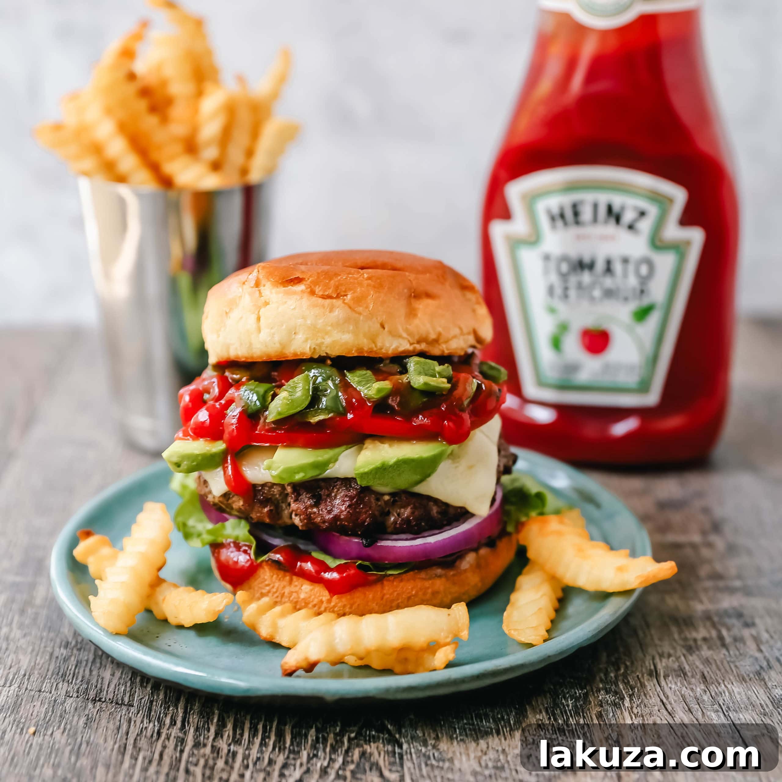 Close-up of a sizzling burger patty on the grill, achieving a perfect crust