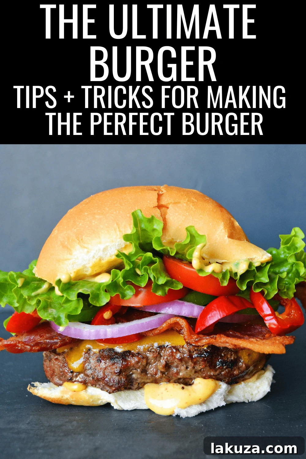 A beautifully assembled Ultimate Burger with melted cheese, fresh toppings, and a golden bun.