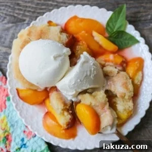 Peach Cobbler. The Best Peach Cobbler Recipe! Fresh peaches tossed with a touch of sugar and topped with a homemade sweet and buttery topping that resembles a mix of a sugar cookie and a sweet biscuit.