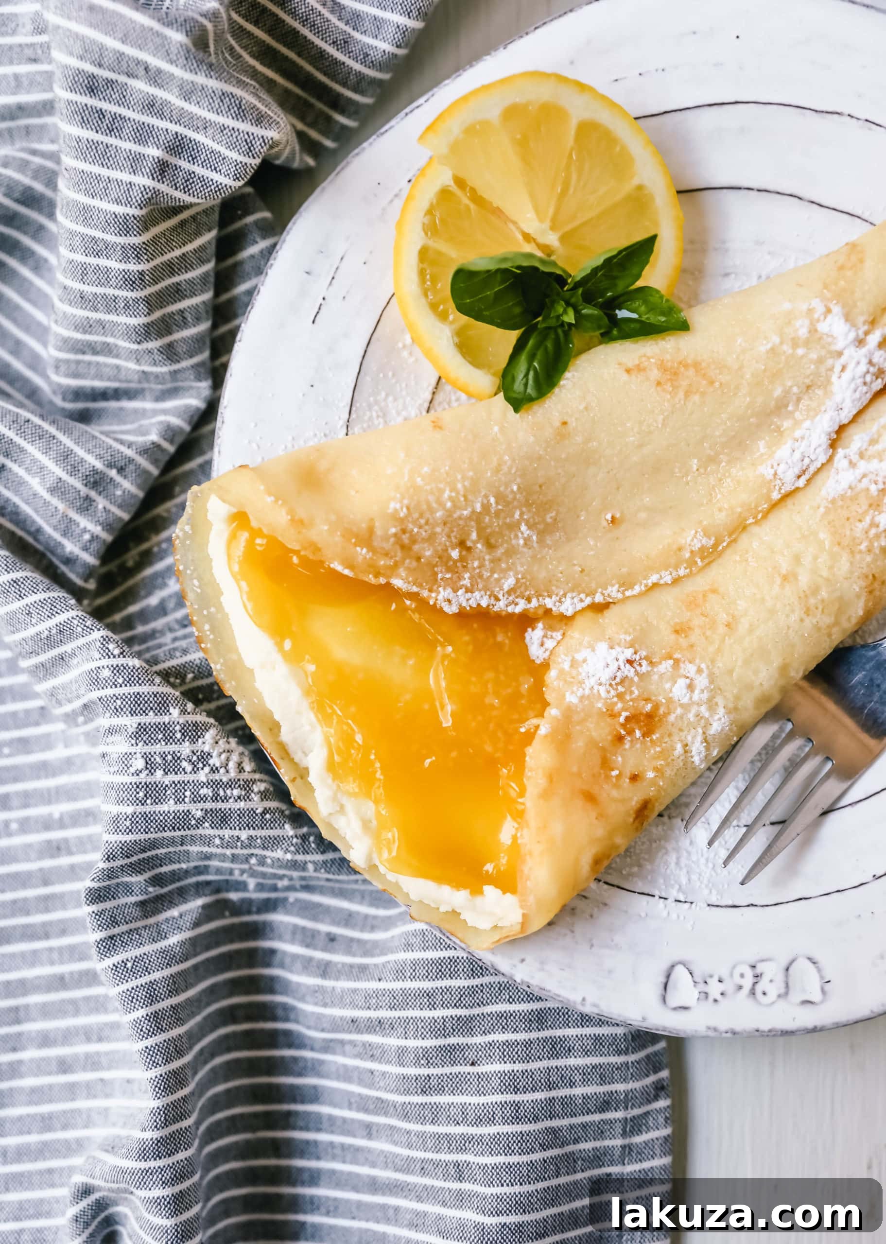 A close-up of a freshly cooked crepe, showcasing its delicate texture.