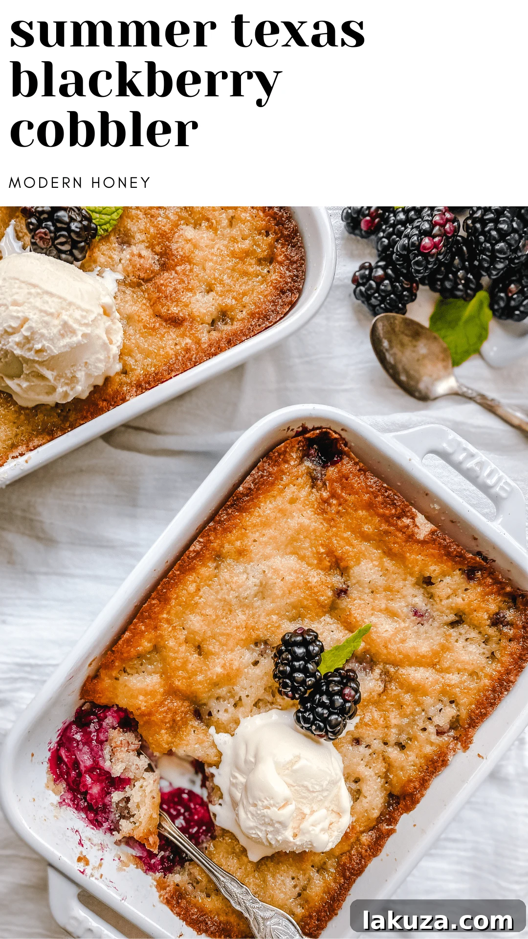 Blackberry Cobbler in a baking dish, served with melting vanilla ice cream.