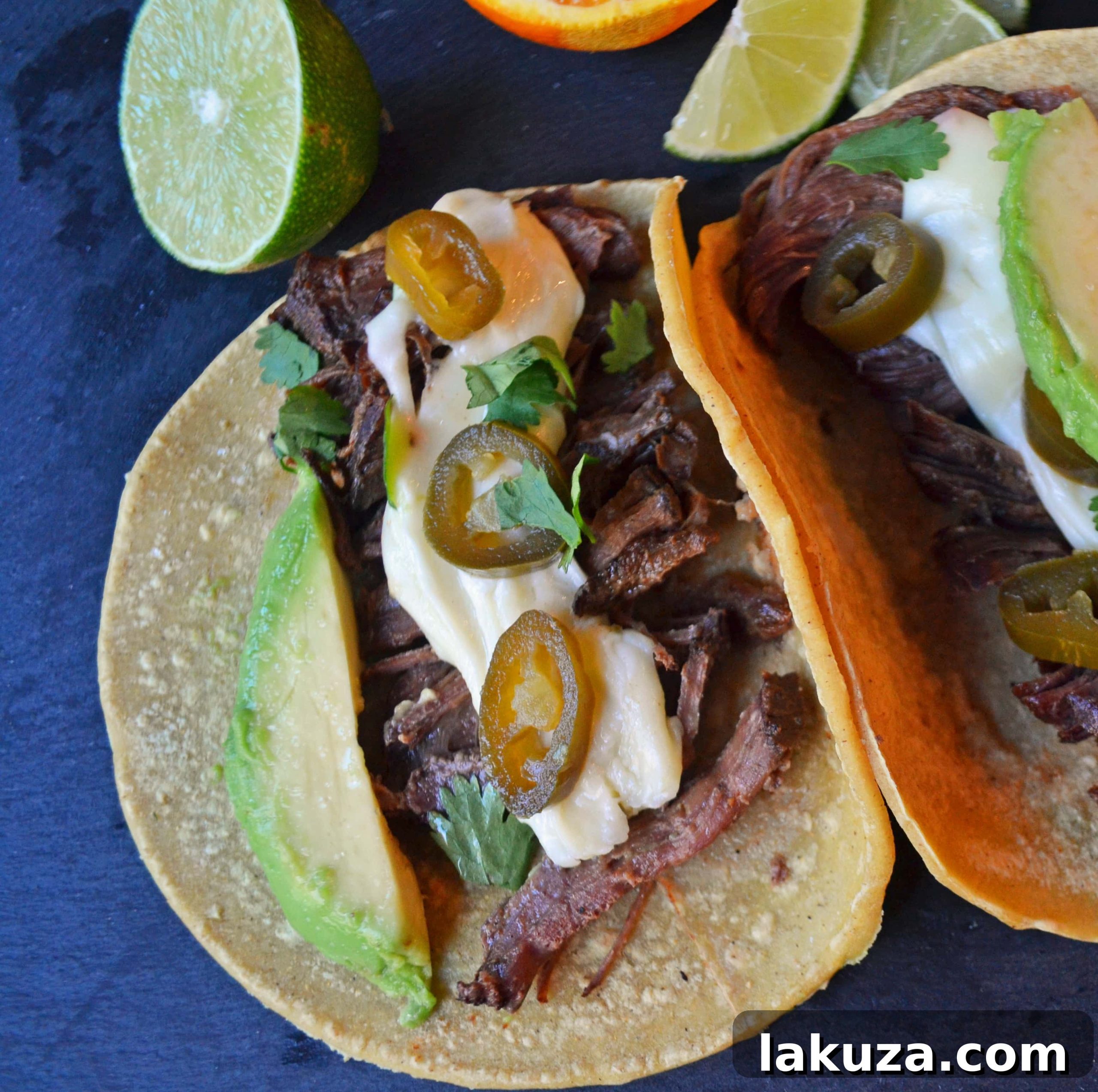 Smoky Beef Barbacoa Tacos with Zesty Pepper Jack Queso 3 Austin-inspired Beef Barbacoa Tacos with Melted Pepper Jack Queso