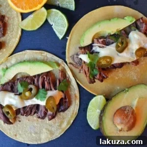 Smoky Beef Barbacoa Tacos with Zesty Pepper Jack Queso 5 Flavorful Beef Barbacoa Tacos with Creamy Pepper Jack Queso