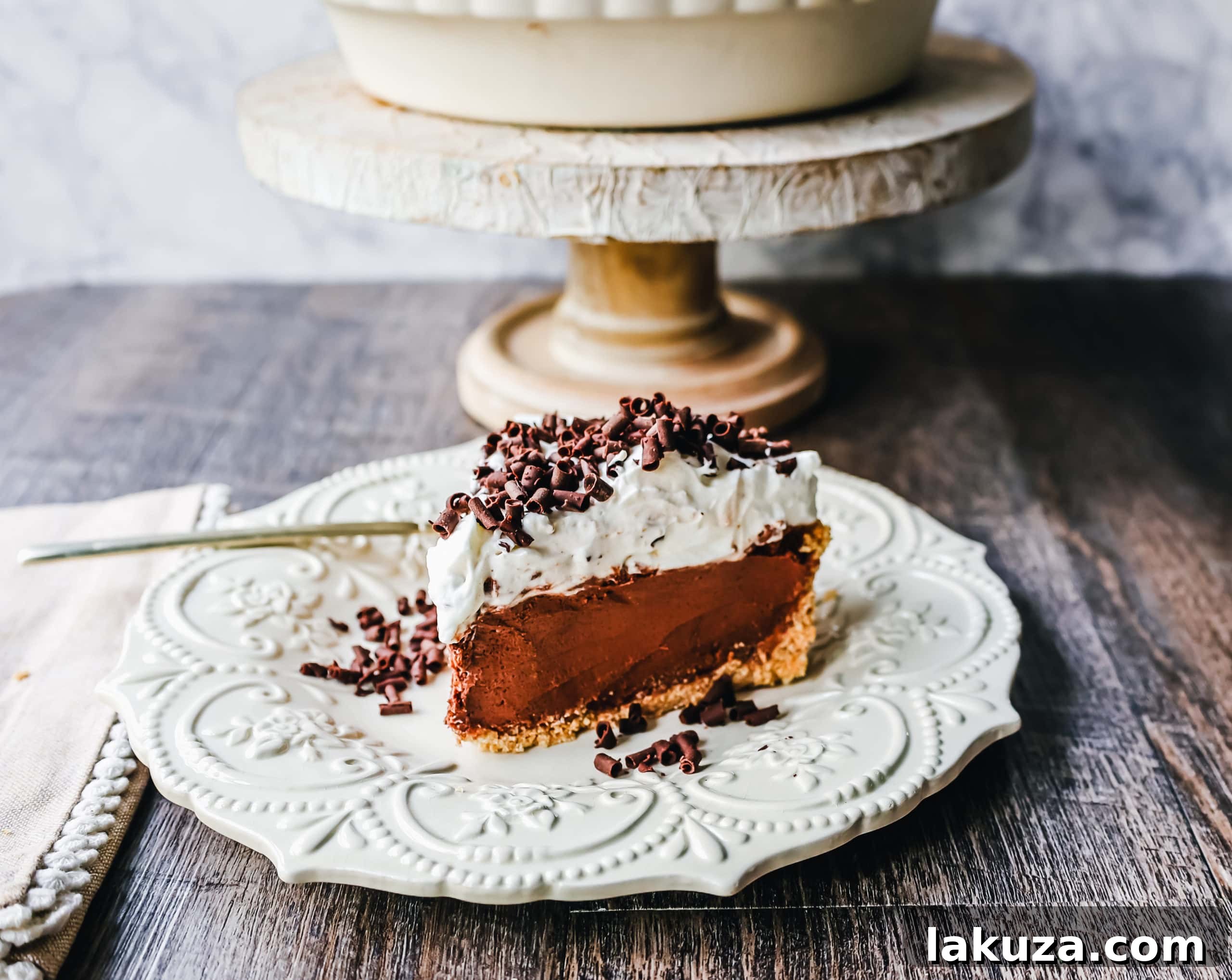 A beautifully composed French Silk Pie in a rustic setting, highlighting its homemade charm and irresistible appeal.