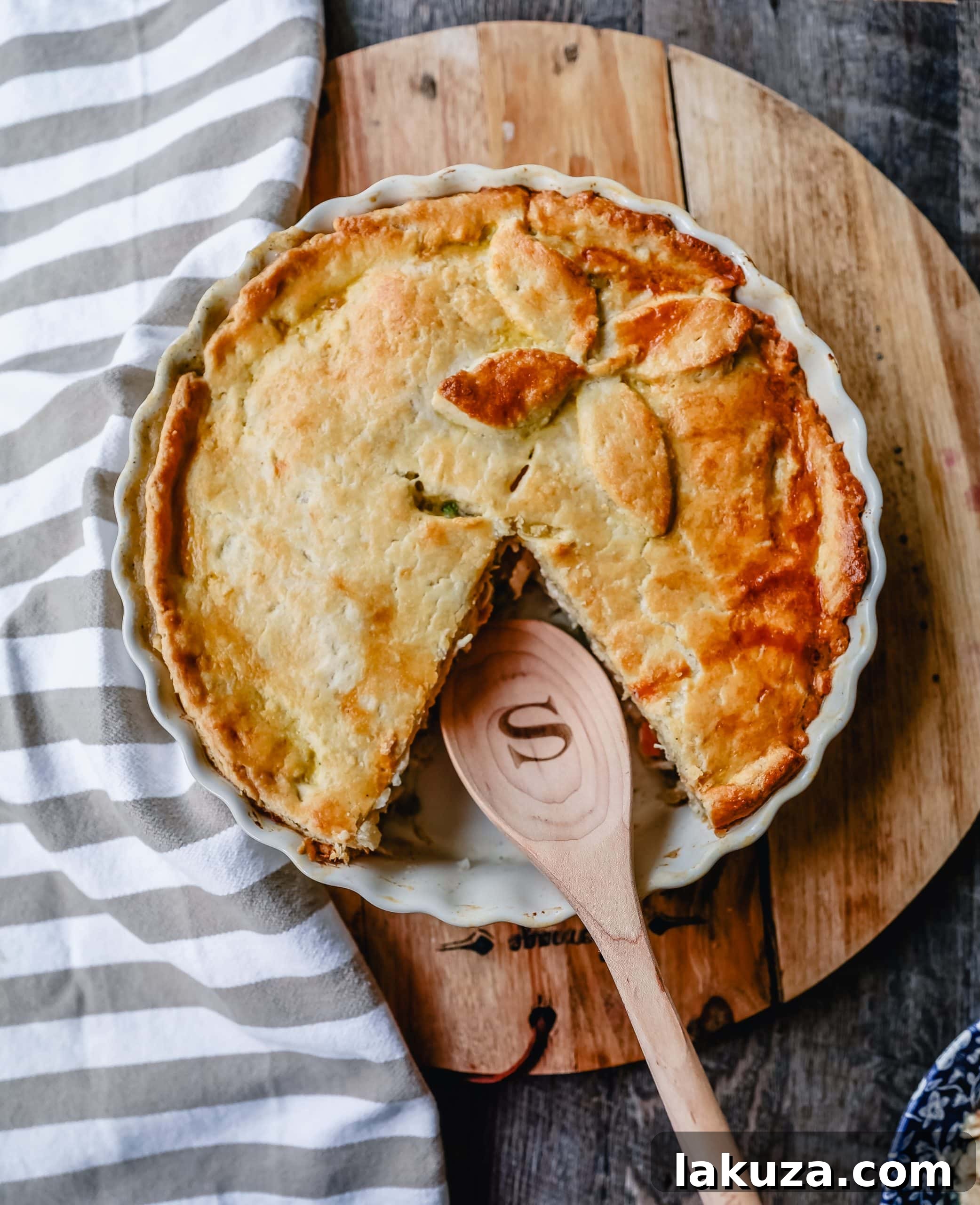 Hand-rolled pie dough for Chicken Pot Pie, illustrating the preparation of the homemade buttery crust.