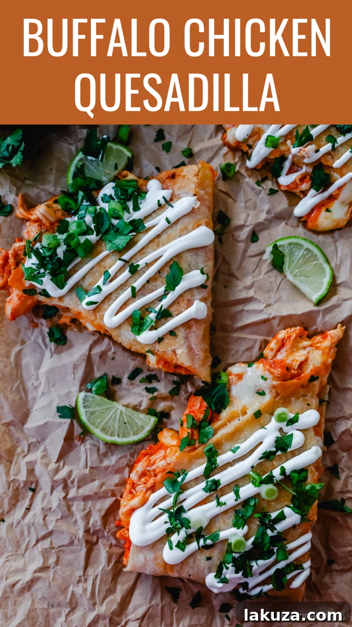 Fiery Buffalo Chicken Quesadilla 2 A top-down view of a Buffalo Chicken Quesadilla, garnished with fresh cilantro and green onions.