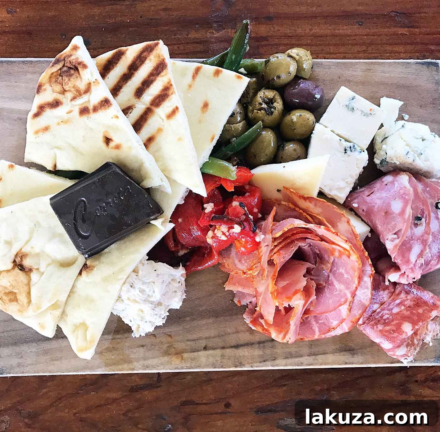 Queen Creek Olive Mill offers a delightful antipasti board with fresh bruschetta, olives, and local cheeses, making it a culinary destination in Arizona.
