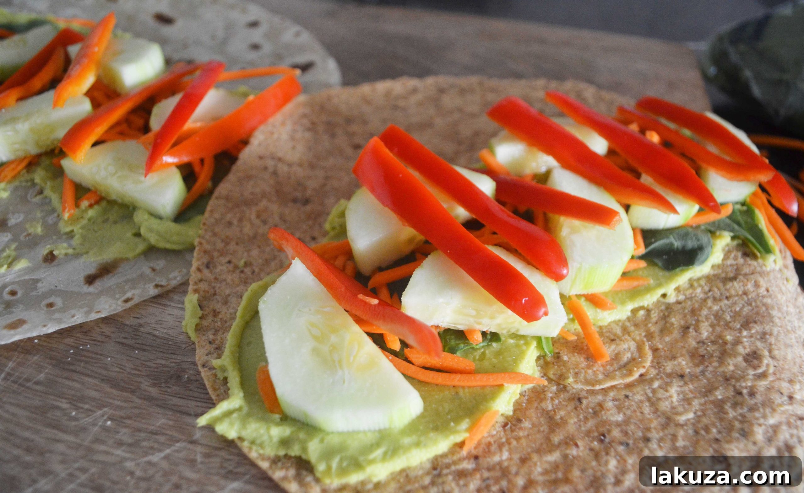Close-up of freshly prepared Avocado Ranch Hummus Veggie Wraps, showcasing the colorful fillings and creamy hummus.