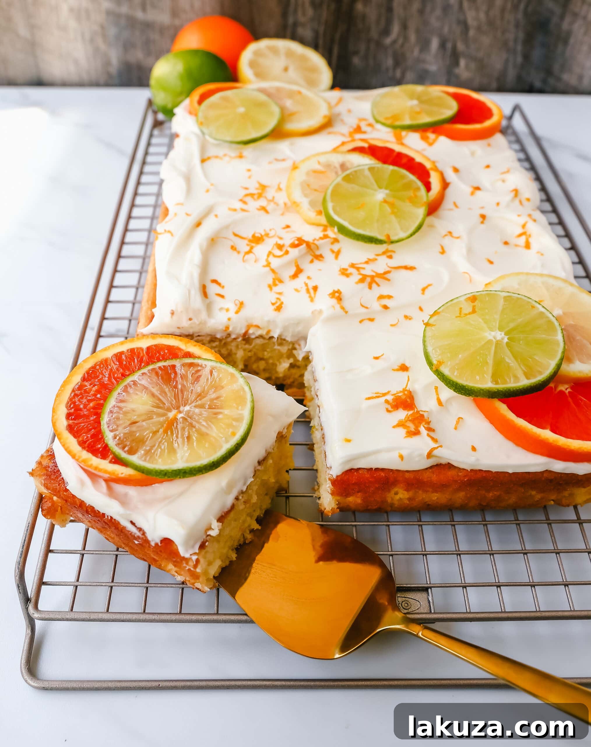 Zesty Citrus Sheet Cake 4 Citrus Sheet Cake made with fresh-squeezed orange, lemon, and lime juices in a moist, fluffy cake and topped with a creamy and silky homemade cream cheese frosting and topped with citrus slices. A beautiful Spring and Summer celebration cake!