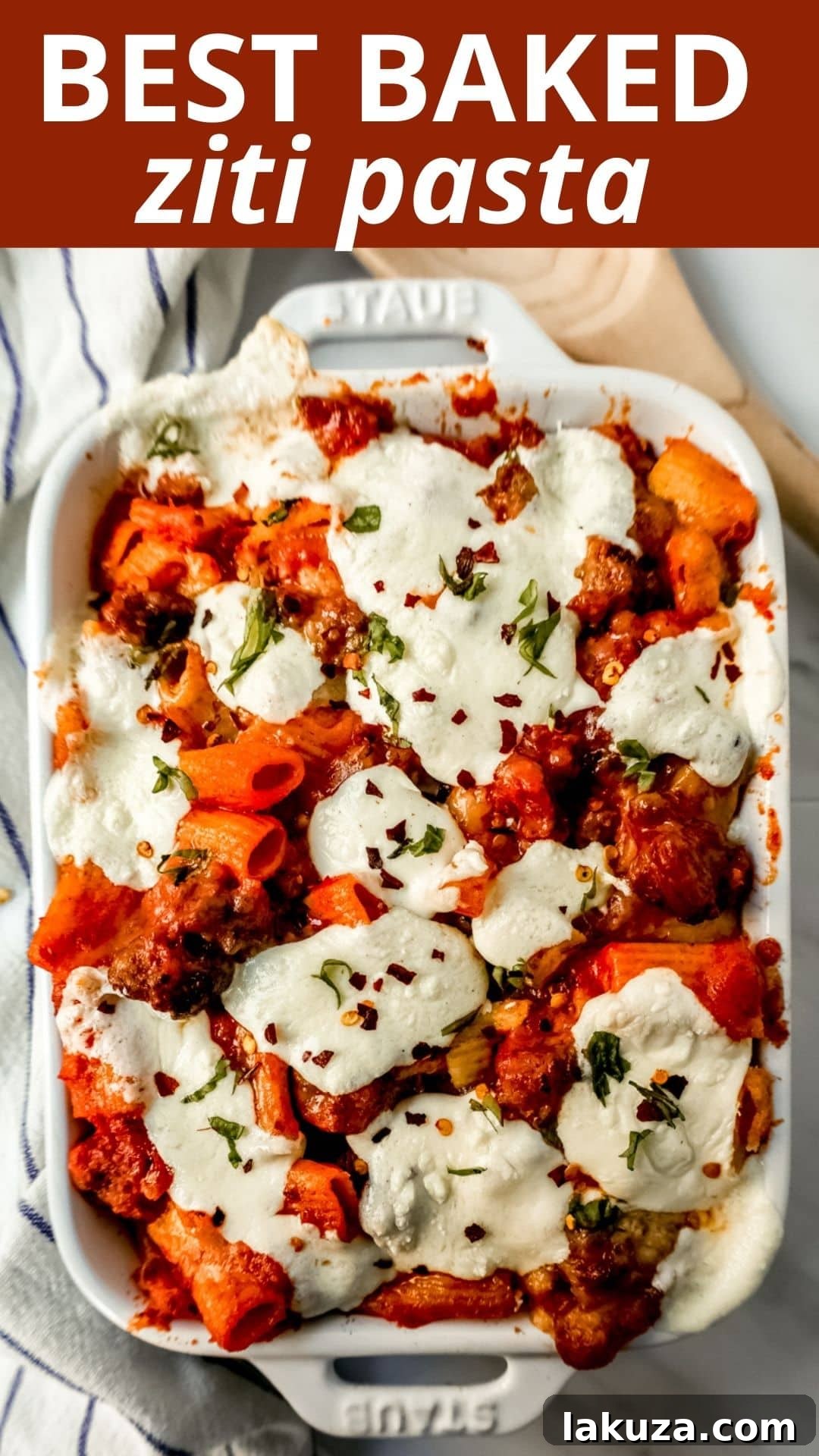 Close-up of a perfectly baked ziti in a baking dish, showing the bubbly cheese and rich sauce.