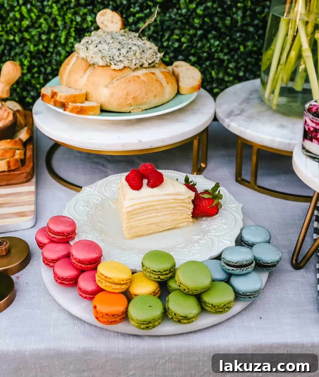 A vibrant assortment of macarons in various pastel colors, beautifully arranged on a serving tray. A perfect elegant dessert for a spring or Easter brunch or party.