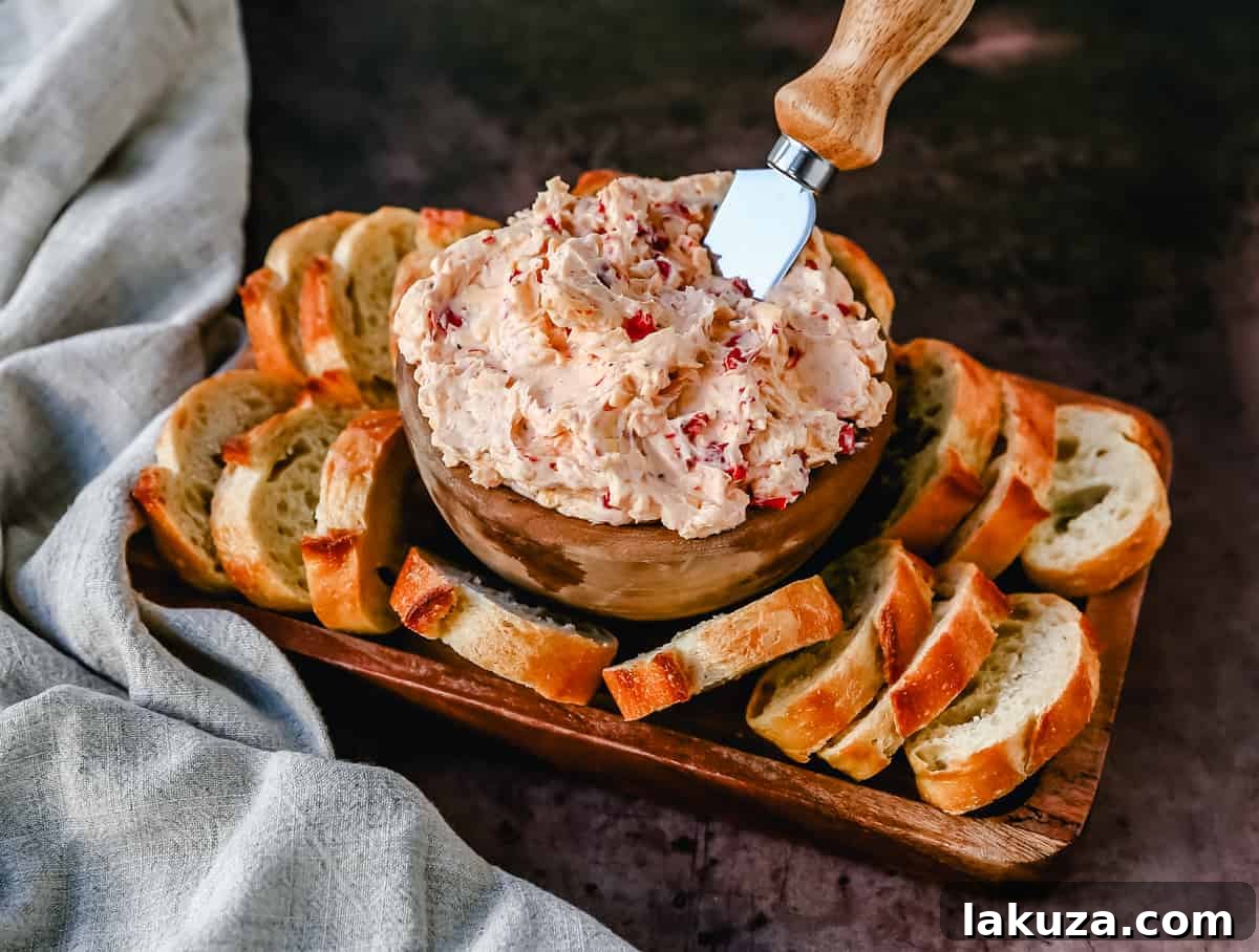 Pimento cheese dip served with an assortment of crackers and fresh vegetables