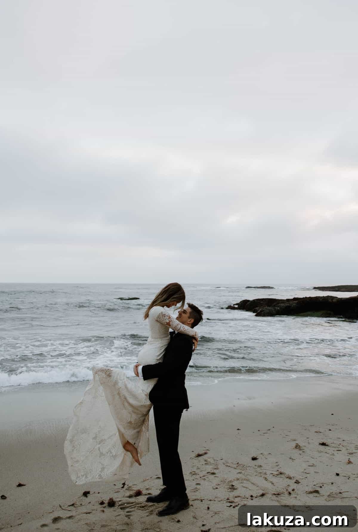 Sierra and Conner posing elegantly on the rocks at Laguna Beach