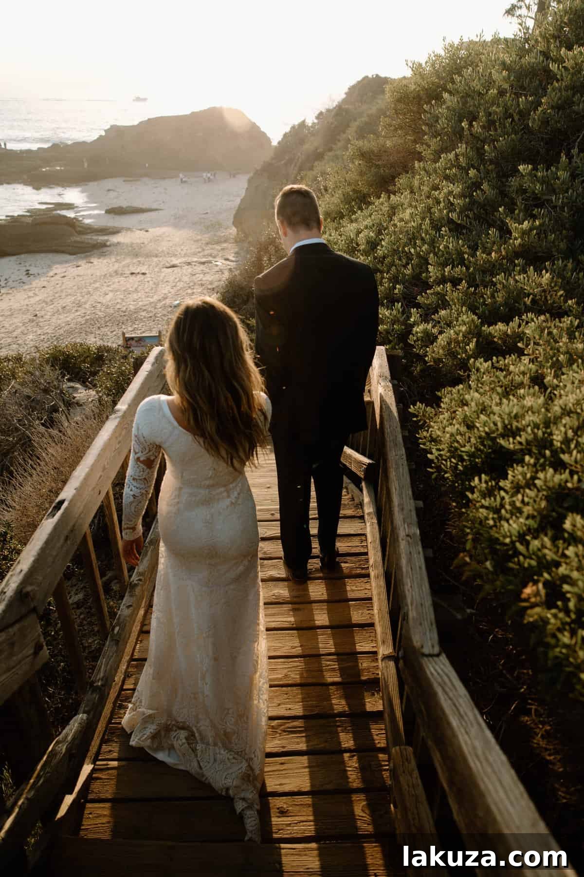 Bride and groom sharing a tender kiss on the beach