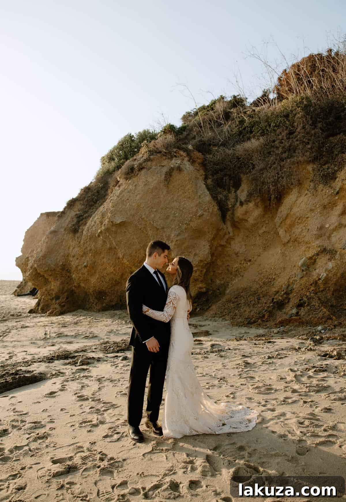 Dramatic bridal portrait of Sierra by the ocean waves