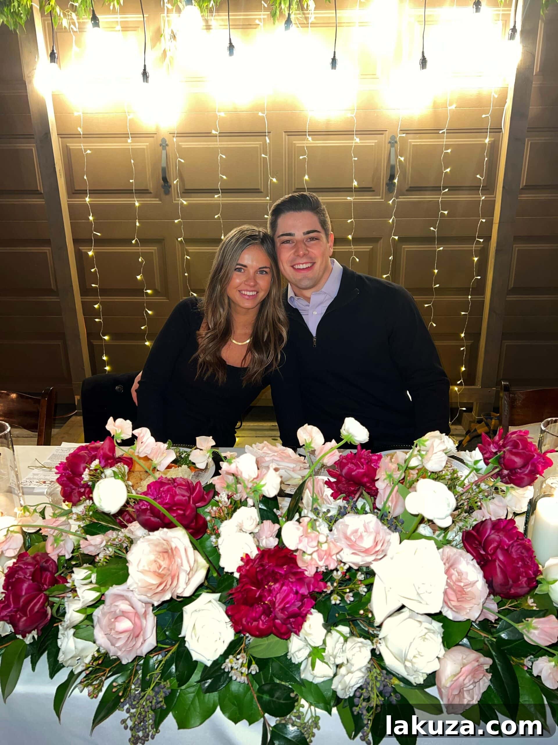 Wedding rehearsal dinner table setting with elegant floral centerpieces
