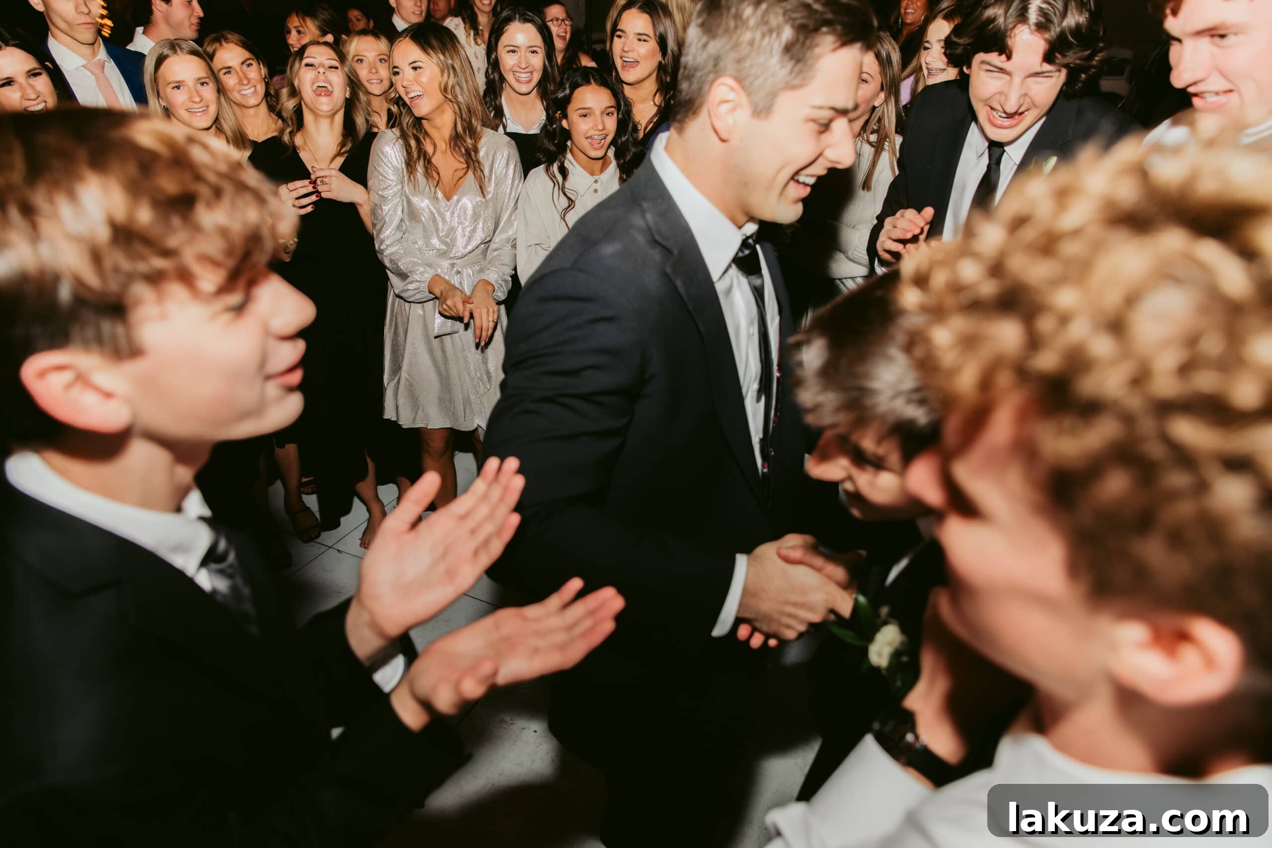 Wedding guests celebrating on the dance floor