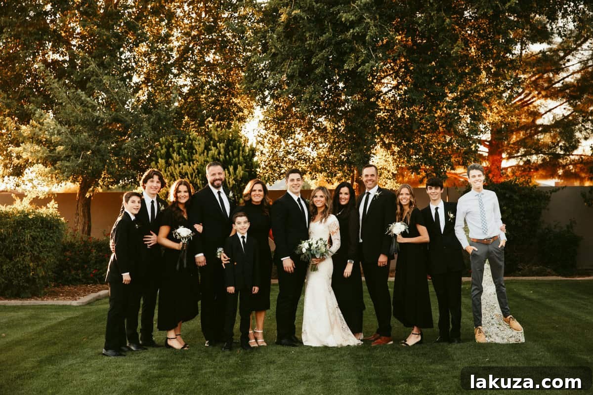 The Peterson family and friends posing happily at the wedding reception