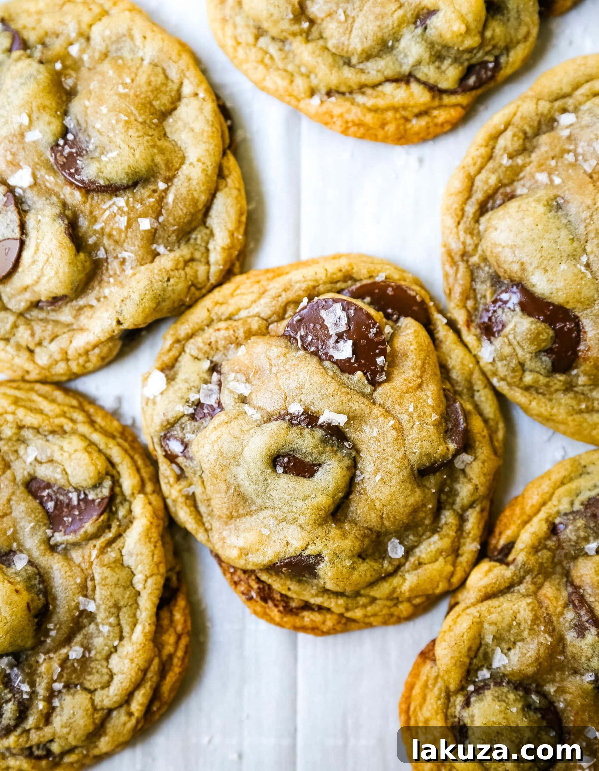 A stack of perfectly baked browned butter chocolate chip cookies showcasing their chewy centers and slightly crispy edges, ready to be enjoyed.