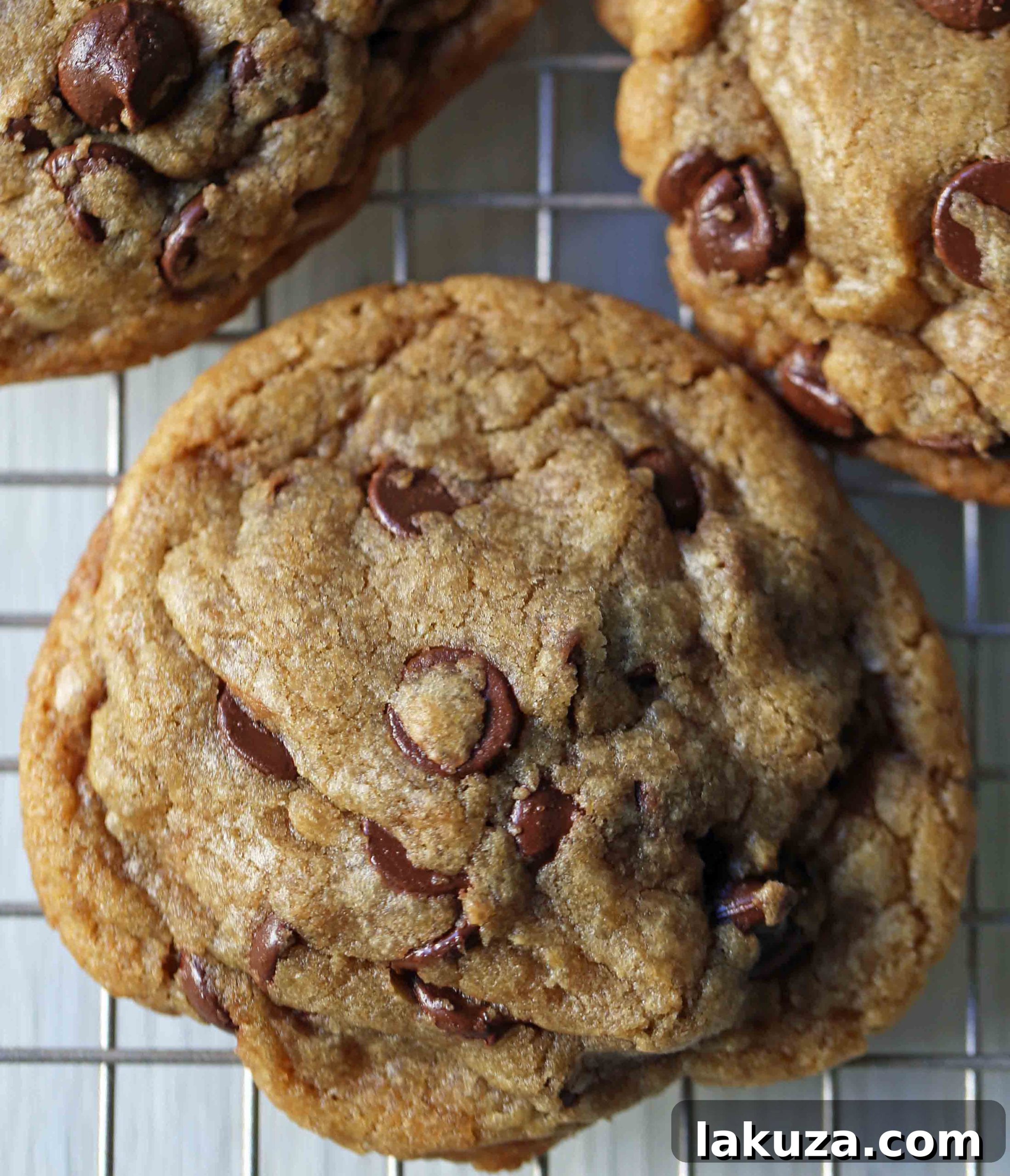 A tempting display of fresh-from-the-oven browned butter chocolate chip cookies, still warm and gooey with melted chocolate.